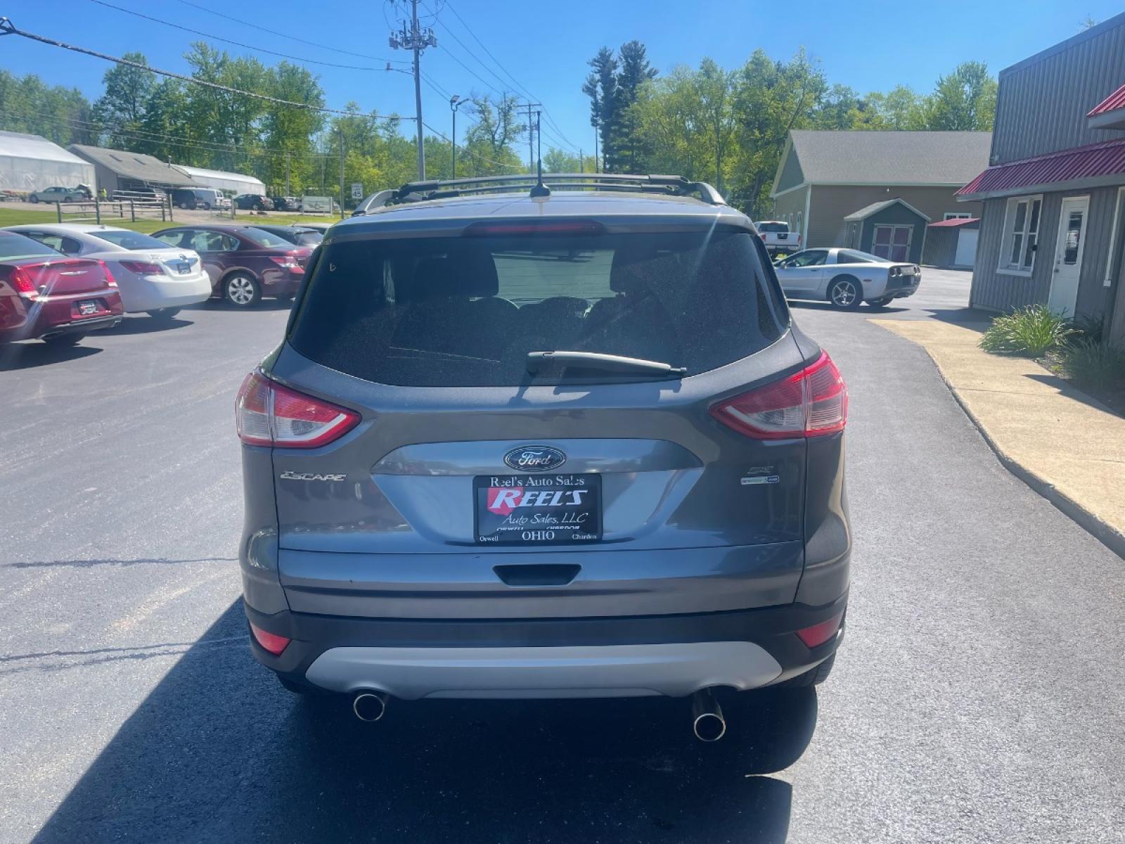 2013 Ingot Silver Metallic /Black and Gray Ford Escape SE AWD (1FMCU9GX1DU) with an 1.6L L4 DOHC 16V engine, 6-Speed Automatic transmission, located at 11115 Chardon Rd. , Chardon, OH, 44024, (440) 214-9705, 41.580246, -81.241943 - Photo #10