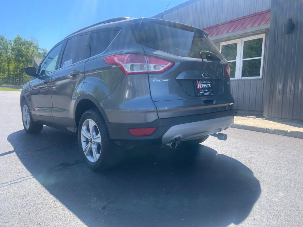 2013 Black /Black and Gray Ford Escape SE AWD (1FMCU9GX1DU) with an 1.6L L4 DOHC 16V engine, 6-Speed Automatic transmission, located at 547 E. Main St., Orwell, OH, 44076, (440) 437-5893, 41.535435, -80.847855 - 2013 Ford Escape SE AWD ---- Clean and Ready to Go ---- Great gas mileage with the benefit of AWD ---- Reel's Auto Sales is located in both Chardon and Orwell Ohio. Financing available and trades welcome. Please call or text to confirm location, set an appointment or discuss financing or trades. Cha - Photo #11