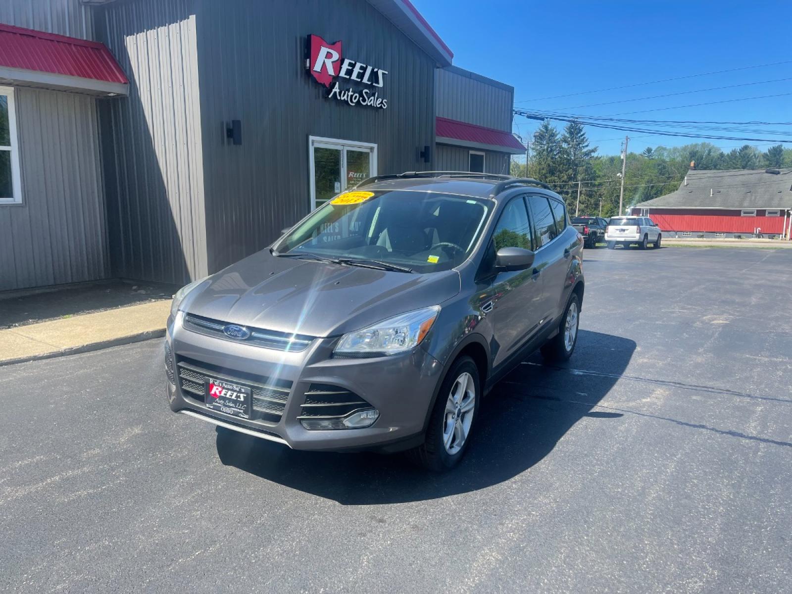 2013 Ingot Silver Metallic /Black and Gray Ford Escape SE AWD (1FMCU9GX1DU) with an 1.6L L4 DOHC 16V engine, 6-Speed Automatic transmission, located at 11115 Chardon Rd. , Chardon, OH, 44024, (440) 214-9705, 41.580246, -81.241943 - Photo #1