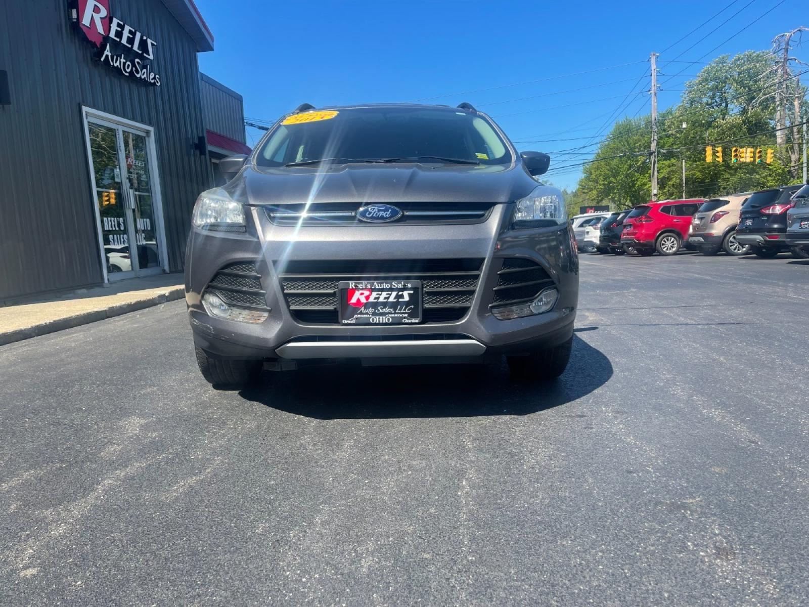 2013 Ingot Silver Metallic /Black and Gray Ford Escape SE AWD (1FMCU9GX1DU) with an 1.6L L4 DOHC 16V engine, 6-Speed Automatic transmission, located at 11115 Chardon Rd. , Chardon, OH, 44024, (440) 214-9705, 41.580246, -81.241943 - Photo #2