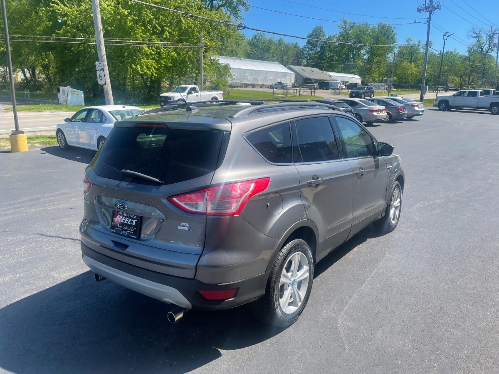 2013 Ingot Silver Metallic /Black and Gray Ford Escape SE AWD (1FMCU9GX1DU) with an 1.6L L4 DOHC 16V engine, 6-Speed Automatic transmission, located at 11115 Chardon Rd. , Chardon, OH, 44024, (440) 214-9705, 41.580246, -81.241943 - Photo #8
