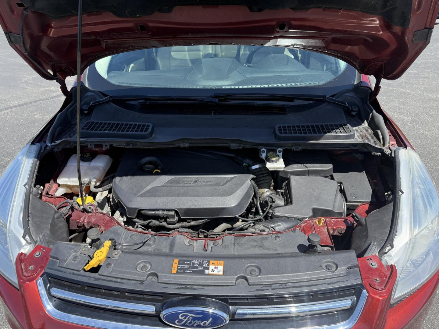 2014 Sunset Metallic /Tan Ford Escape Titanium 4WD (1FMCU9JX7EU) with an 1.6L I4 DOHC 16V TURBO engine, 6-Speed Automatic transmission, located at 547 E. Main St., Orwell, OH, 44076, (440) 437-5893, 41.535435, -80.847855 - This 2014 Ford Escape is a well equipped compact SUV. With a 1.6L EcoBoost turbocharged I4 engine paired with a 6-speed automatic transmission, delivering an impressive 30 MPG on the highway. It offers a luxurious interior with leather seats, heated front seats, and dual-zone automatic climate contr - Photo#3