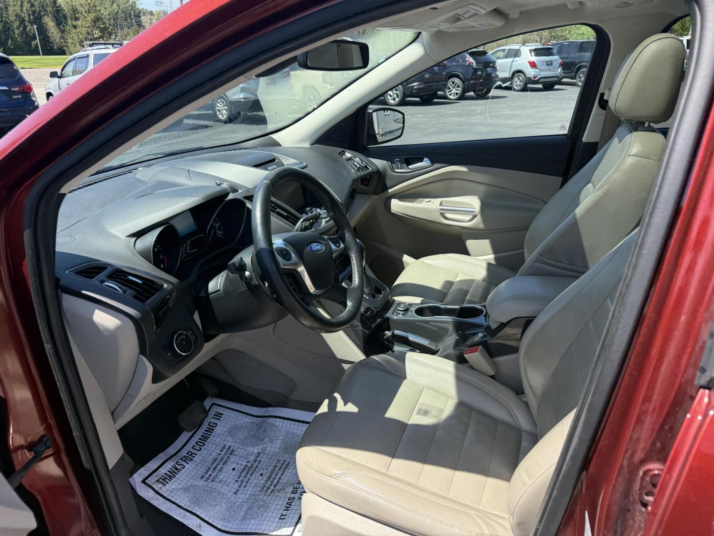 2014 Sunset Metallic /Tan Ford Escape Titanium 4WD (1FMCU9JX7EU) with an 1.6L I4 DOHC 16V TURBO engine, 6-Speed Automatic transmission, located at 547 E. Main St., Orwell, OH, 44076, (440) 437-5893, 41.535435, -80.847855 - This 2014 Ford Escape is a well equipped compact SUV. With a 1.6L EcoBoost turbocharged I4 engine paired with a 6-speed automatic transmission, delivering an impressive 30 MPG on the highway. It offers a luxurious interior with leather seats, heated front seats, and dual-zone automatic climate contr - Photo#15