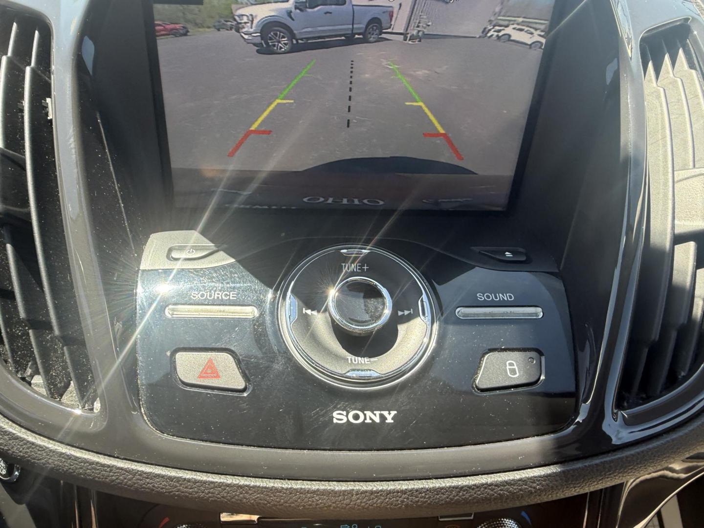 2014 Sunset Metallic /Tan Ford Escape Titanium 4WD (1FMCU9JX7EU) with an 1.6L I4 DOHC 16V TURBO engine, 6-Speed Automatic transmission, located at 547 E. Main St., Orwell, OH, 44076, (440) 437-5893, 41.535435, -80.847855 - This 2014 Ford Escape is a well equipped compact SUV. With a 1.6L EcoBoost turbocharged I4 engine paired with a 6-speed automatic transmission, delivering an impressive 30 MPG on the highway. It offers a luxurious interior with leather seats, heated front seats, and dual-zone automatic climate contr - Photo#24