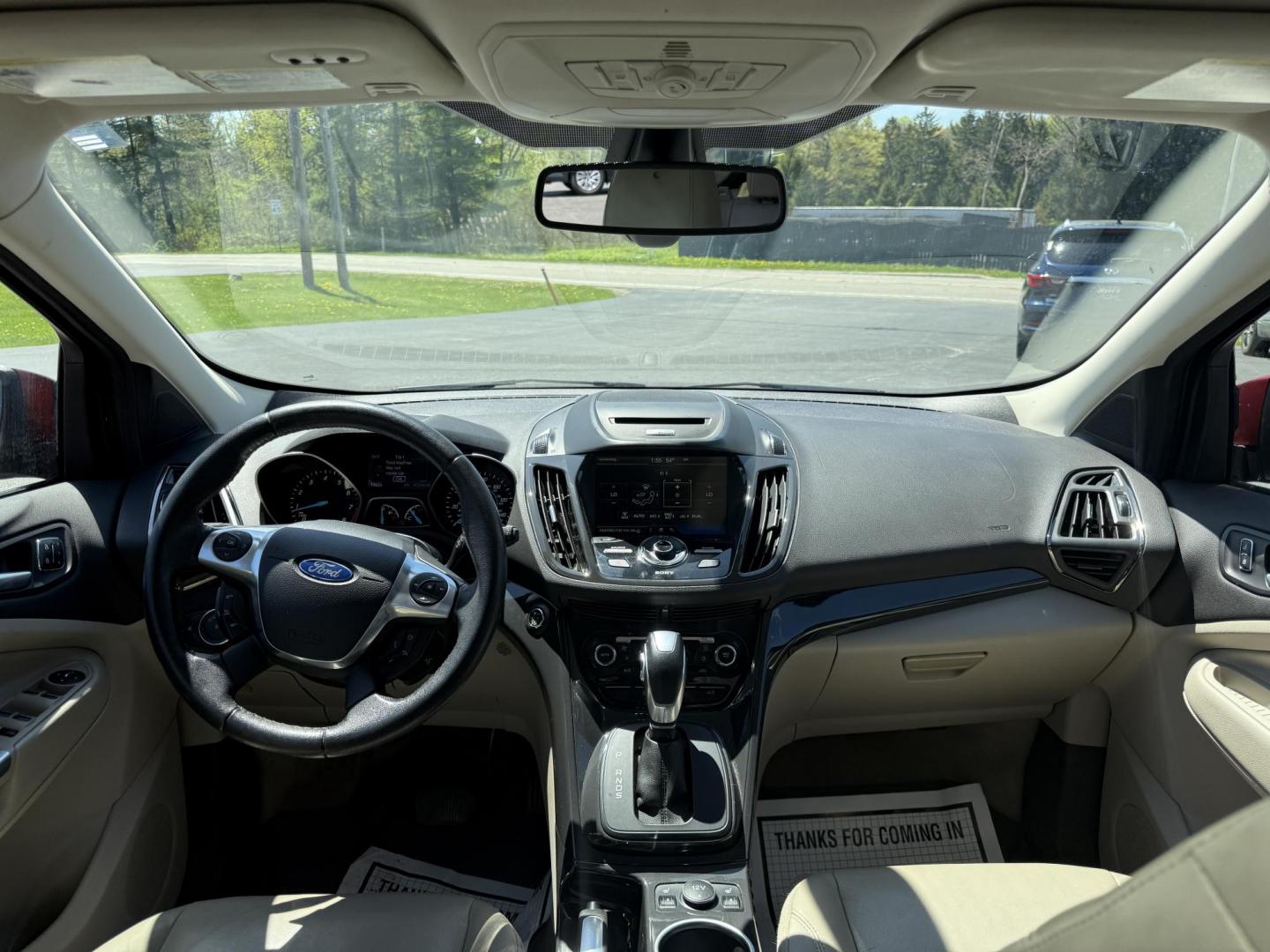2014 Sunset Metallic /Tan Ford Escape Titanium 4WD (1FMCU9JX7EU) with an 1.6L I4 DOHC 16V TURBO engine, 6-Speed Automatic transmission, located at 547 E. Main St., Orwell, OH, 44076, (440) 437-5893, 41.535435, -80.847855 - This 2014 Ford Escape is a well equipped compact SUV. With a 1.6L EcoBoost turbocharged I4 engine paired with a 6-speed automatic transmission, delivering an impressive 30 MPG on the highway. It offers a luxurious interior with leather seats, heated front seats, and dual-zone automatic climate contr - Photo#35