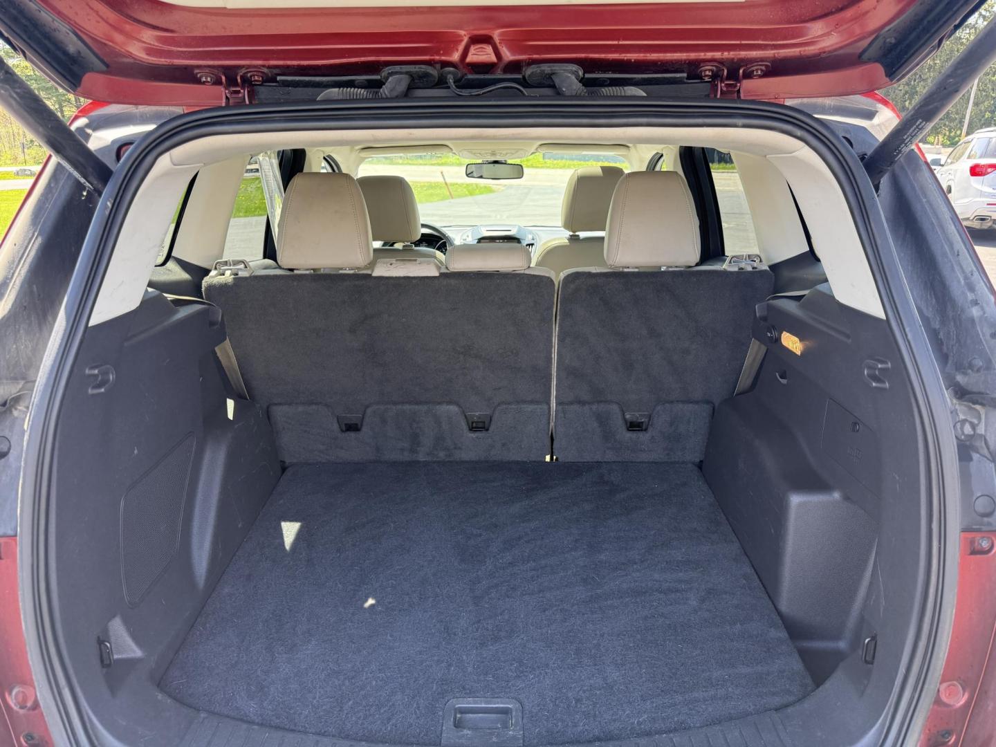 2014 Sunset Metallic /Tan Ford Escape Titanium 4WD (1FMCU9JX7EU) with an 1.6L I4 DOHC 16V TURBO engine, 6-Speed Automatic transmission, located at 547 E. Main St., Orwell, OH, 44076, (440) 437-5893, 41.535435, -80.847855 - This 2014 Ford Escape is a well equipped compact SUV. With a 1.6L EcoBoost turbocharged I4 engine paired with a 6-speed automatic transmission, delivering an impressive 30 MPG on the highway. It offers a luxurious interior with leather seats, heated front seats, and dual-zone automatic climate contr - Photo#36