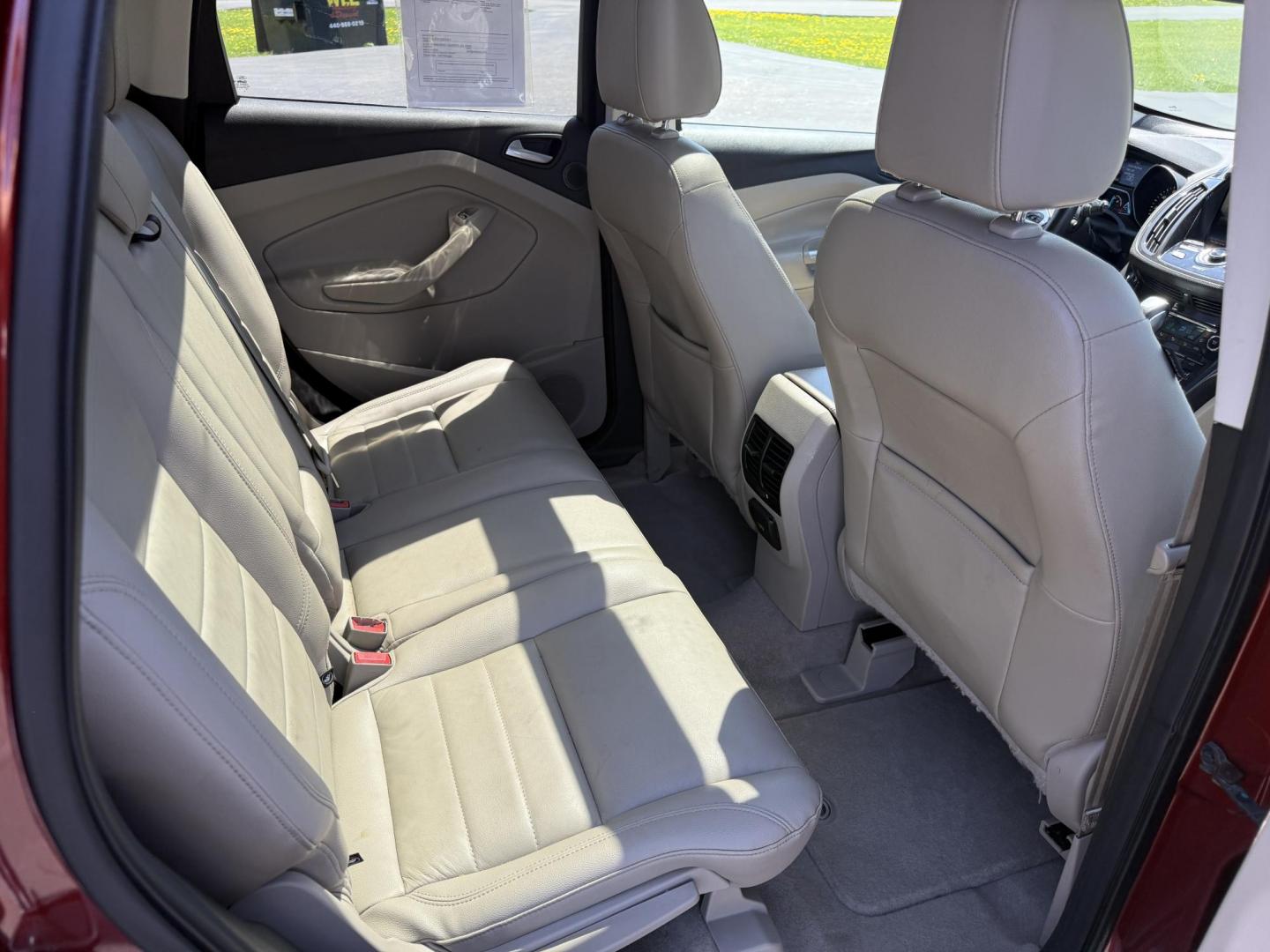 2014 Sunset Metallic /Tan Ford Escape Titanium 4WD (1FMCU9JX7EU) with an 1.6L I4 DOHC 16V TURBO engine, 6-Speed Automatic transmission, located at 547 E. Main St., Orwell, OH, 44076, (440) 437-5893, 41.535435, -80.847855 - This 2014 Ford Escape is a well equipped compact SUV. With a 1.6L EcoBoost turbocharged I4 engine paired with a 6-speed automatic transmission, delivering an impressive 30 MPG on the highway. It offers a luxurious interior with leather seats, heated front seats, and dual-zone automatic climate contr - Photo#39