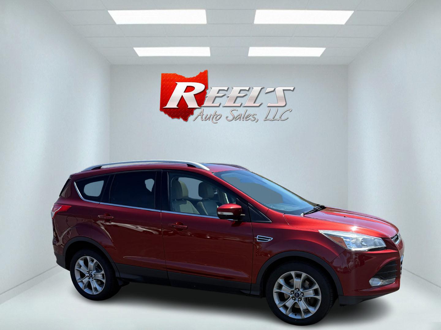 2014 Sunset Metallic /Tan Ford Escape Titanium 4WD (1FMCU9JX7EU) with an 1.6L I4 DOHC 16V TURBO engine, 6-Speed Automatic transmission, located at 547 E. Main St., Orwell, OH, 44076, (440) 437-5893, 41.535435, -80.847855 - This 2014 Ford Escape is a well equipped compact SUV. With a 1.6L EcoBoost turbocharged I4 engine paired with a 6-speed automatic transmission, delivering an impressive 30 MPG on the highway. It offers a luxurious interior with leather seats, heated front seats, and dual-zone automatic climate contr - Photo#10