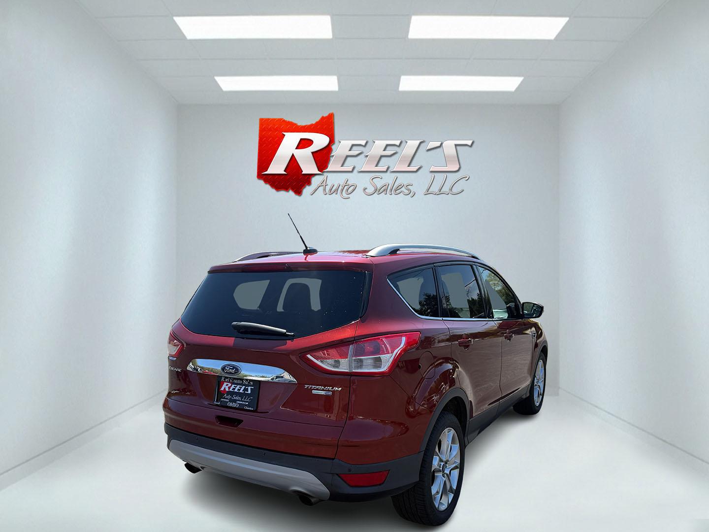 2014 Sunset Metallic /Tan Ford Escape Titanium 4WD (1FMCU9JX7EU) with an 1.6L I4 DOHC 16V TURBO engine, 6-Speed Automatic transmission, located at 547 E. Main St., Orwell, OH, 44076, (440) 437-5893, 41.535435, -80.847855 - This 2014 Ford Escape is a well equipped compact SUV. With a 1.6L EcoBoost turbocharged I4 engine paired with a 6-speed automatic transmission, delivering an impressive 30 MPG on the highway. It offers a luxurious interior with leather seats, heated front seats, and dual-zone automatic climate contr - Photo#11
