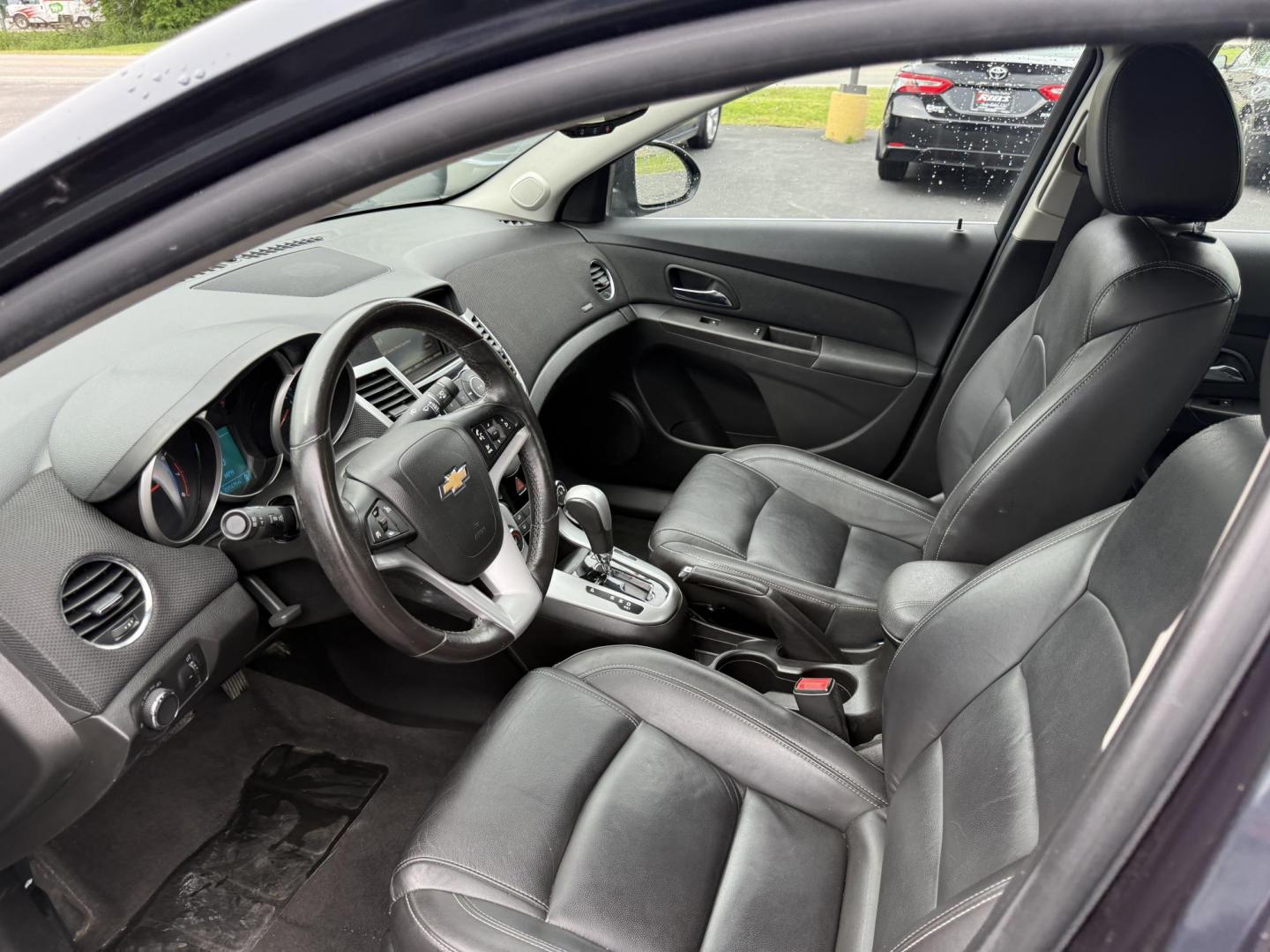 2015 Blue /Black Chevrolet Cruze 2LT Auto (1G1PE5SB7F7) with an 1.4L I4 DOHC 16V TURBO engine, 6-Speed Automatic transmission, located at 547 E. Main St., Orwell, OH, 44076, (440) 437-5893, 41.535435, -80.847855 - This 2015 Chevrolet Cruze is a nicely optioned compact car. Powered by a 1.4 I4 Turbocharged EcoTec engine and a 6 speed automatic transmission it achieves a very respectable 36 MPG highway. On the inside you get a leather interior, power drivers seat and, heated seats. This Car also has remote star - Photo#8