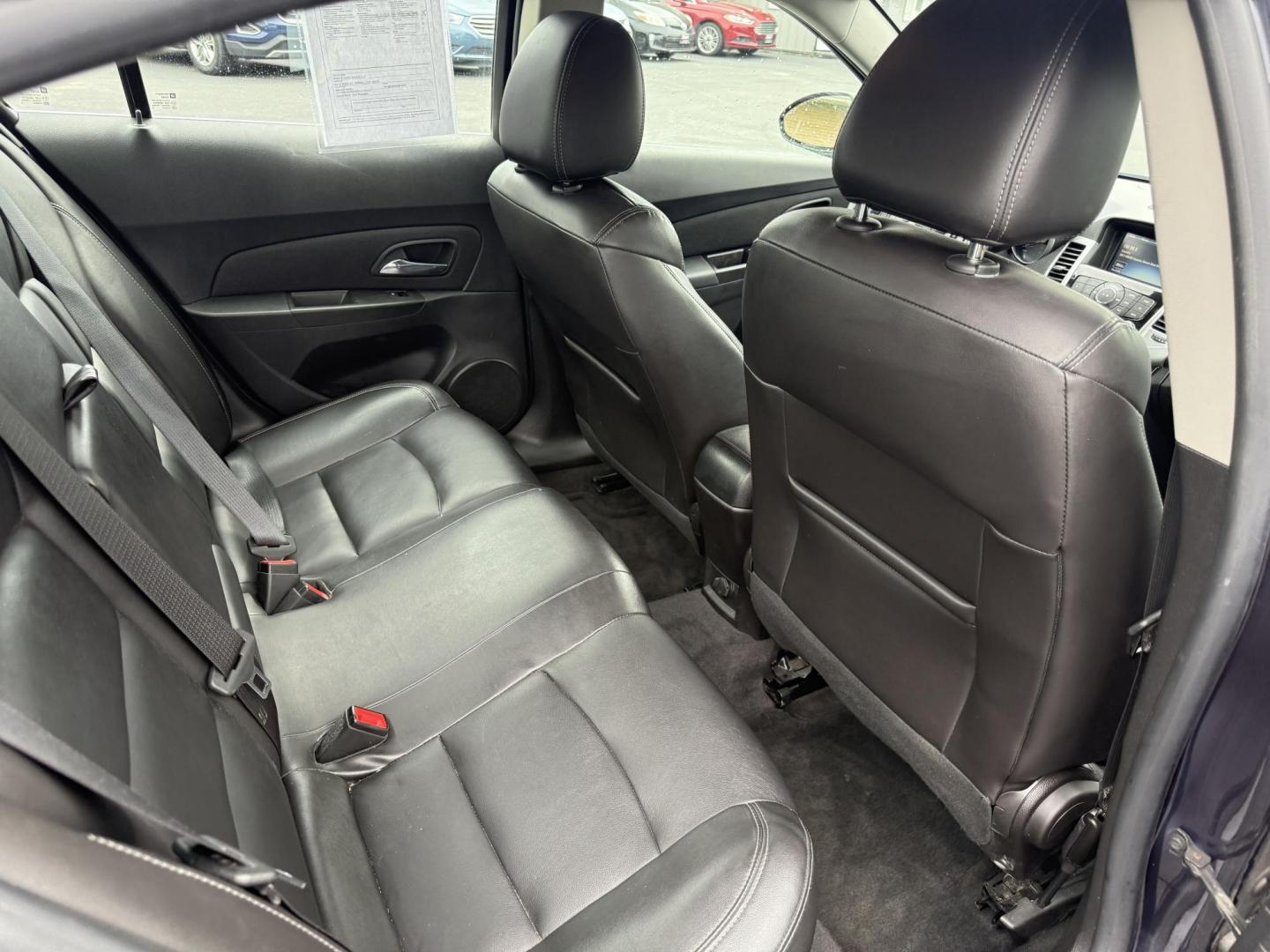 2015 Blue /Black Chevrolet Cruze 2LT Auto (1G1PE5SB7F7) with an 1.4L I4 DOHC 16V TURBO engine, 6-Speed Automatic transmission, located at 547 E. Main St., Orwell, OH, 44076, (440) 437-5893, 41.535435, -80.847855 - This 2015 Chevrolet Cruze is a nicely optioned compact car. Powered by a 1.4 I4 Turbocharged EcoTec engine and a 6 speed automatic transmission it achieves a very respectable 36 MPG highway. On the inside you get a leather interior, power drivers seat and, heated seats. This Car also has remote star - Photo#29