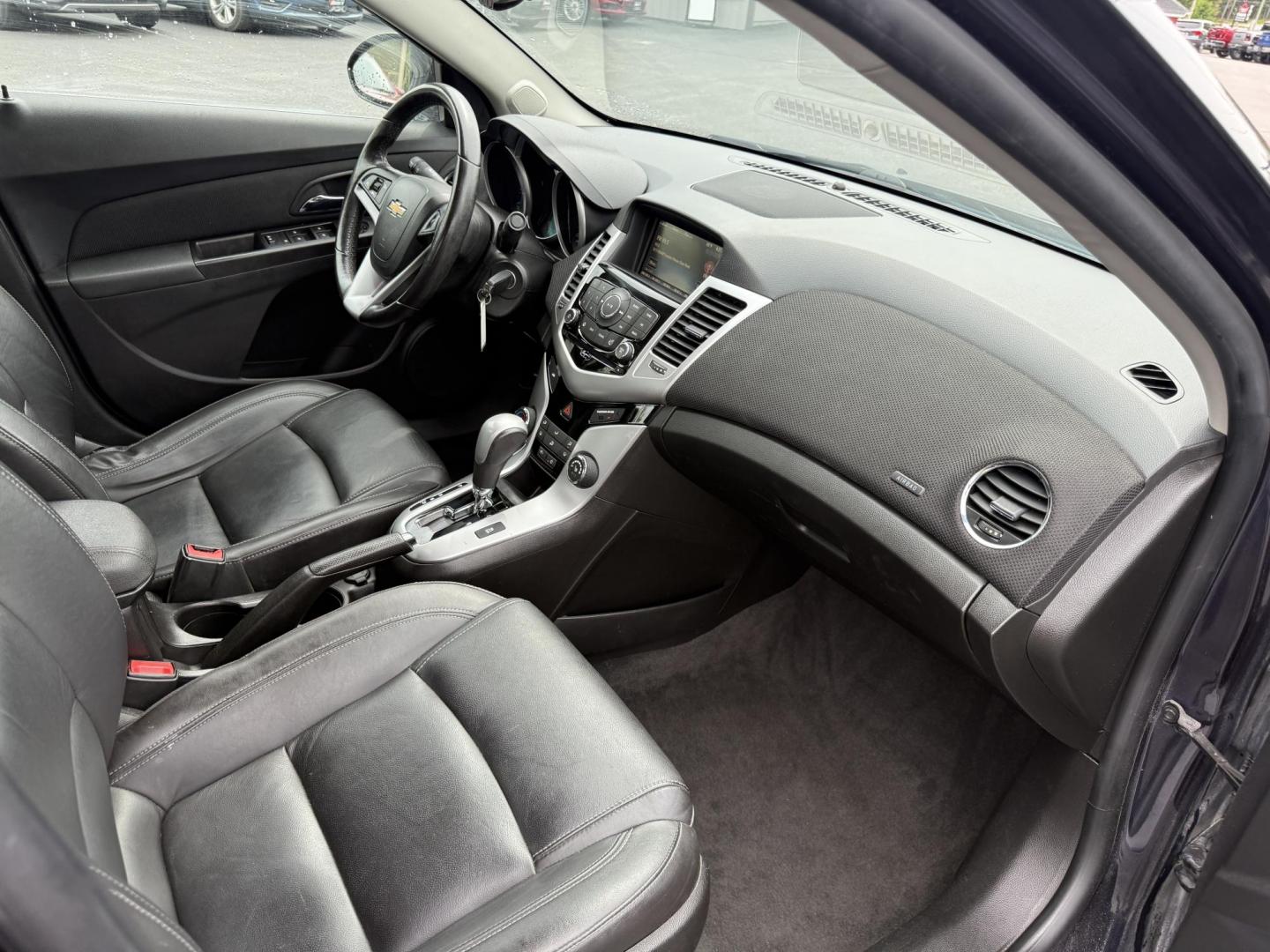 2015 Blue /Black Chevrolet Cruze 2LT Auto (1G1PE5SB7F7) with an 1.4L I4 DOHC 16V TURBO engine, 6-Speed Automatic transmission, located at 547 E. Main St., Orwell, OH, 44076, (440) 437-5893, 41.535435, -80.847855 - This 2015 Chevrolet Cruze is a nicely optioned compact car. Powered by a 1.4 I4 Turbocharged EcoTec engine and a 6 speed automatic transmission it achieves a very respectable 36 MPG highway. On the inside you get a leather interior, power drivers seat and, heated seats. This Car also has remote star - Photo#31
