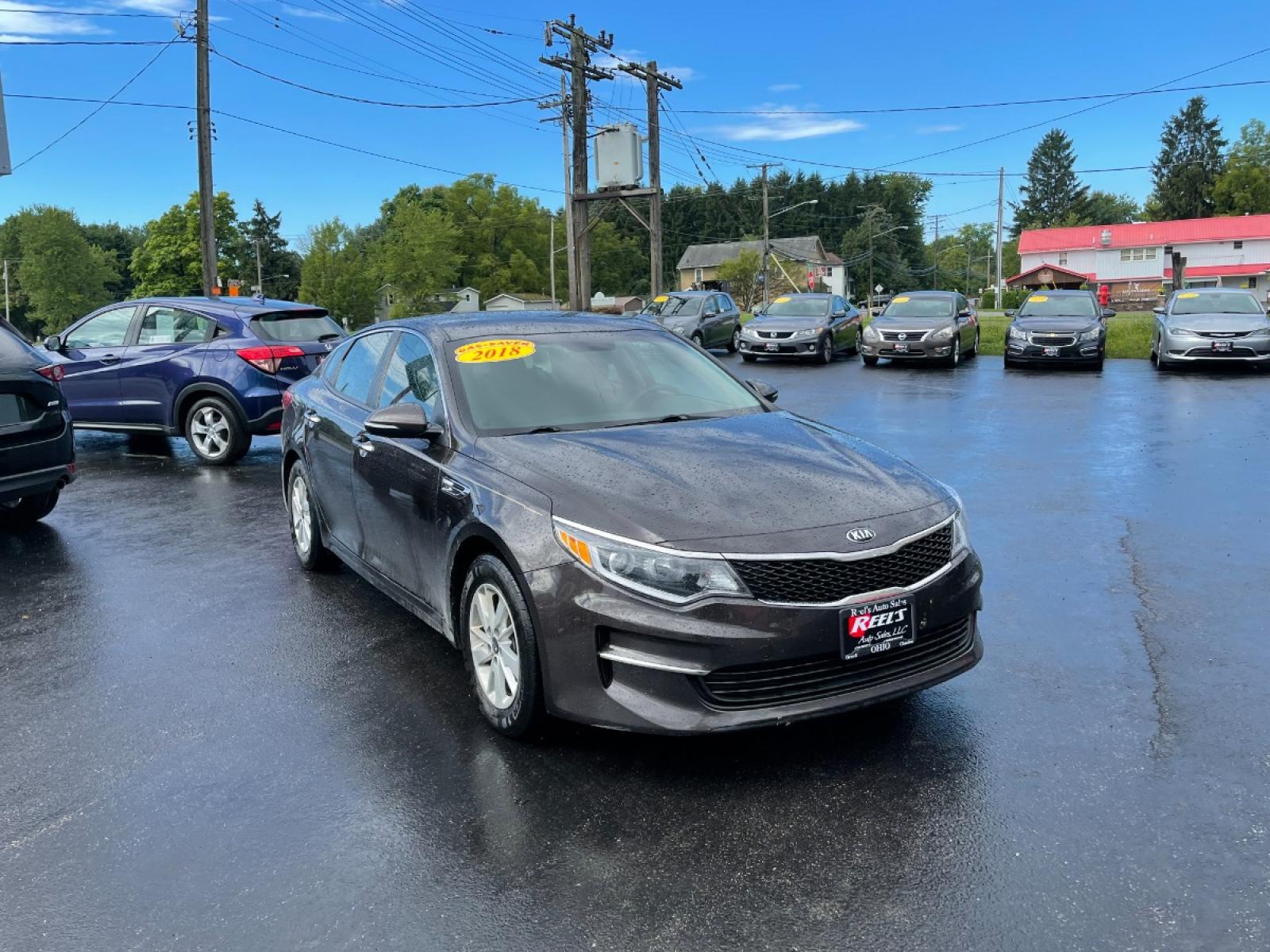 2018 Brown /Black Kia Optima LX (KNAGT4L3XJ5) with an 2.4L I4 DOHC 16V engine, 6-Speed Automatic transmission, located at 11115 Chardon Rd. , Chardon, OH, 44024, (440) 214-9705, 41.580246, -81.241943 - 2018 Kia Optima ---- 29MPG Combined ---- Clean Inside and Out ---- Local Trade In ---- Fully Serviced and Recently Detailed ---- Reel's Auto Sales is located in both Chardon and Orwell Ohio. Financing available and trades welcome. Please call or text to confirm location, set an appointment or discus - Photo #5