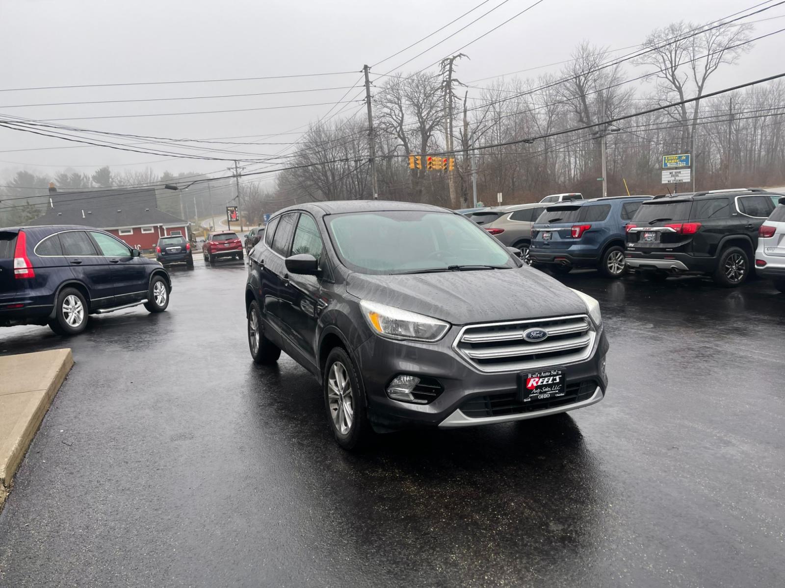 2017 Gray /Black Ford Escape SE 4WD (1FMCU9GD4HU) with an 1.5L I4 DOHC 16V TURBO engine, 6A transmission, located at 11115 Chardon Rd. , Chardon, OH, 44024, (440) 214-9705, 41.580246, -81.241943 - 2017 Ford Escape ---- All Wheel Drive ---- 24 MPG Combined ---- Fully Serviced and Recently Detailed ---- Reel's Auto Sales is located in both Chardon and Orwell Ohio. Financing available and trades welcome. Please call or text to confirm location, set an appointment or discuss financing or trades. - Photo #2