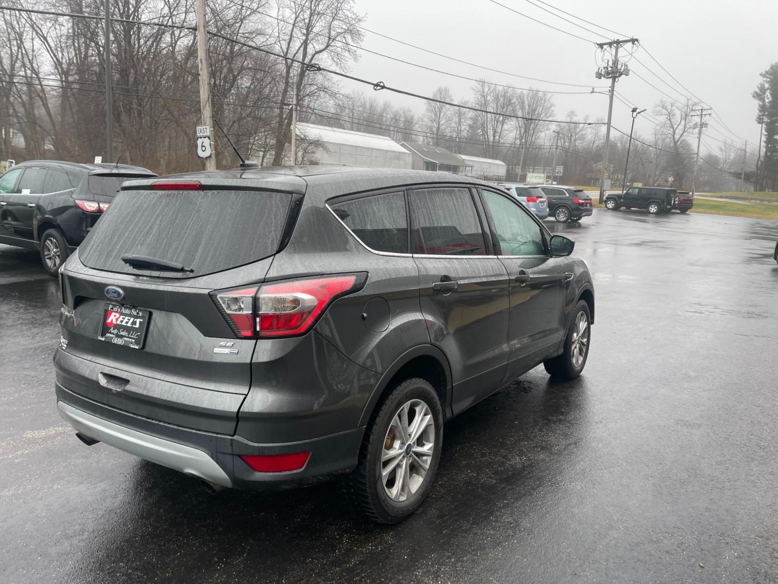 2017 Gray /Black Ford Escape SE 4WD (1FMCU9GD4HU) with an 1.5L I4 DOHC 16V TURBO engine, 6A transmission, located at 11115 Chardon Rd. , Chardon, OH, 44024, (440) 214-9705, 41.580246, -81.241943 - 2017 Ford Escape ---- All Wheel Drive ---- 24 MPG Combined ---- Fully Serviced and Recently Detailed ---- Reel's Auto Sales is located in both Chardon and Orwell Ohio. Financing available and trades welcome. Please call or text to confirm location, set an appointment or discuss financing or trades. - Photo #7