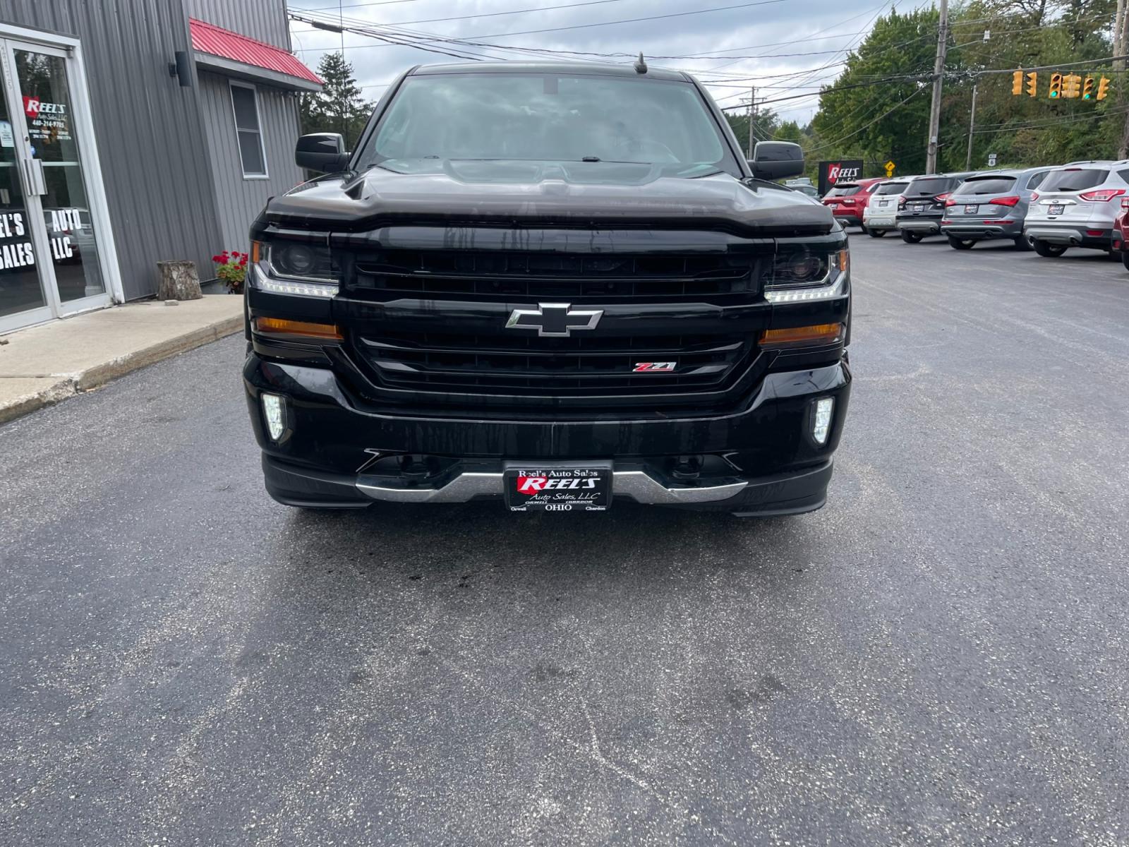 2018 Black /Black Chevrolet Silverado 1500 2LT Crew Cab 4WD (3GCUKREC9JG) with an 5.3L V8 OHV 16V engine, 6A transmission, located at 11115 Chardon Rd. , Chardon, OH, 44024, (440) 214-9705, 41.580246, -81.241943 - The 2018 Chevrolet Silverado 2LT Crew Cab Z71 5.3 comes with a powerful 5.3-liter V8 engine that generates 355 horsepower and 383 lb-ft of torque. It has a towing capacity of up to 9,100 pounds and can go from 0 to 60 mph in 6.7 seconds. The Z71 package includes off-road suspension, skid plates, and - Photo #1