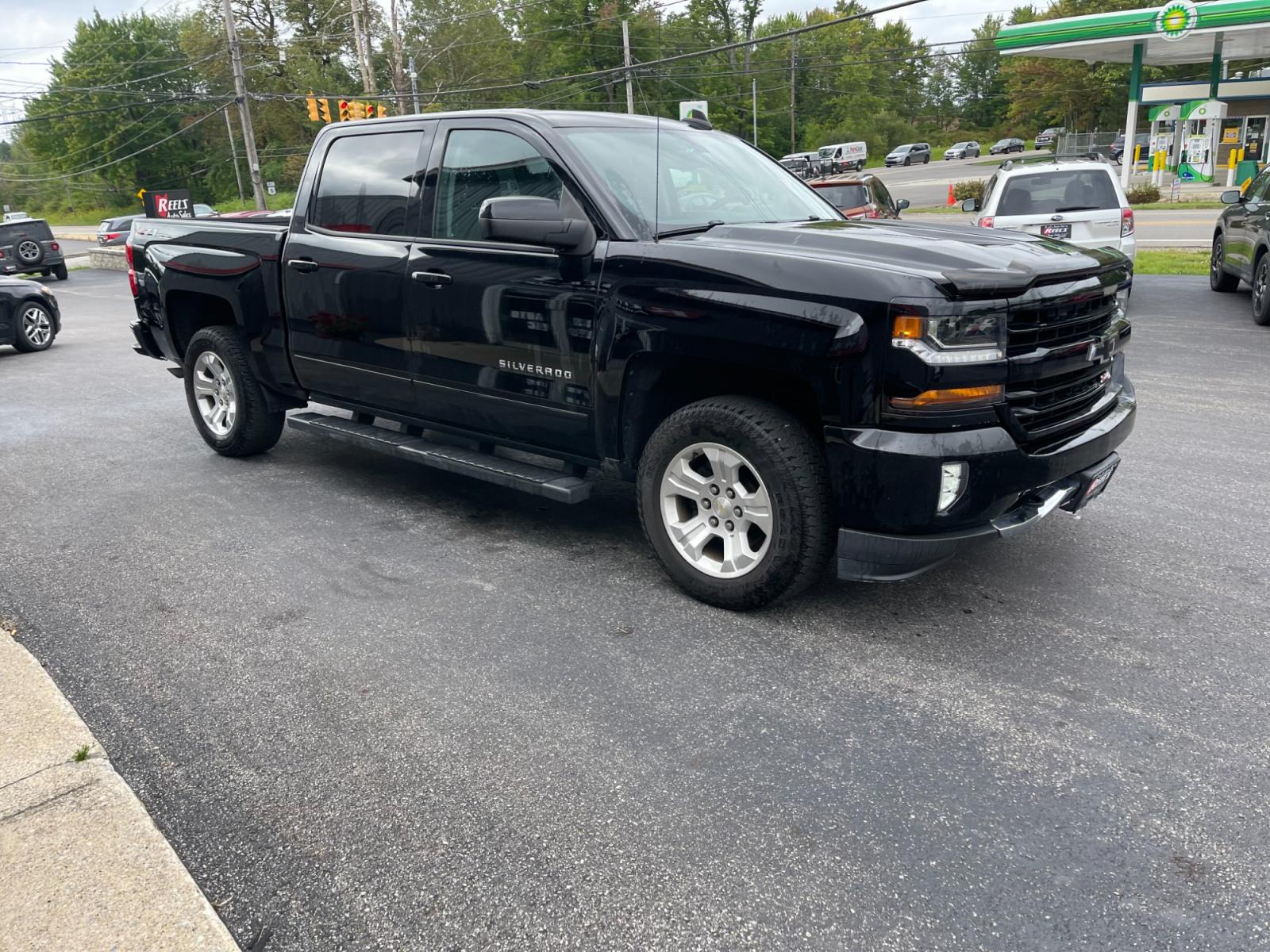2018 Black /Black Chevrolet Silverado 1500 2LT Crew Cab 4WD (3GCUKREC9JG) with an 5.3L V8 OHV 16V engine, 6A transmission, located at 11115 Chardon Rd. , Chardon, OH, 44024, (440) 214-9705, 41.580246, -81.241943 - The 2018 Chevrolet Silverado 2LT Crew Cab Z71 5.3 comes with a powerful 5.3-liter V8 engine that generates 355 horsepower and 383 lb-ft of torque. It has a towing capacity of up to 9,100 pounds and can go from 0 to 60 mph in 6.7 seconds. The Z71 package includes off-road suspension, skid plates, and - Photo #4