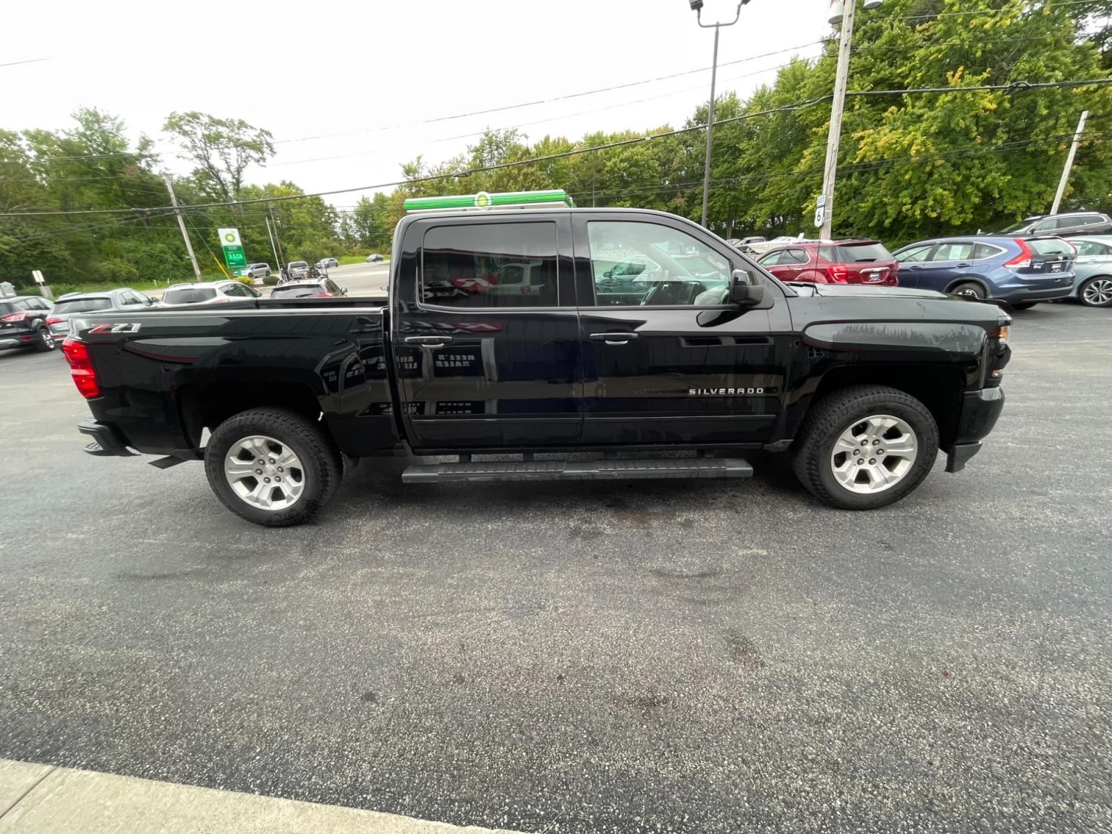 2018 Black /Black Chevrolet Silverado 1500 2LT Crew Cab 4WD (3GCUKREC9JG) with an 5.3L V8 OHV 16V engine, 6A transmission, located at 11115 Chardon Rd. , Chardon, OH, 44024, (440) 214-9705, 41.580246, -81.241943 - The 2018 Chevrolet Silverado 2LT Crew Cab Z71 5.3 comes with a powerful 5.3-liter V8 engine that generates 355 horsepower and 383 lb-ft of torque. It has a towing capacity of up to 9,100 pounds and can go from 0 to 60 mph in 6.7 seconds. The Z71 package includes off-road suspension, skid plates, and - Photo #6