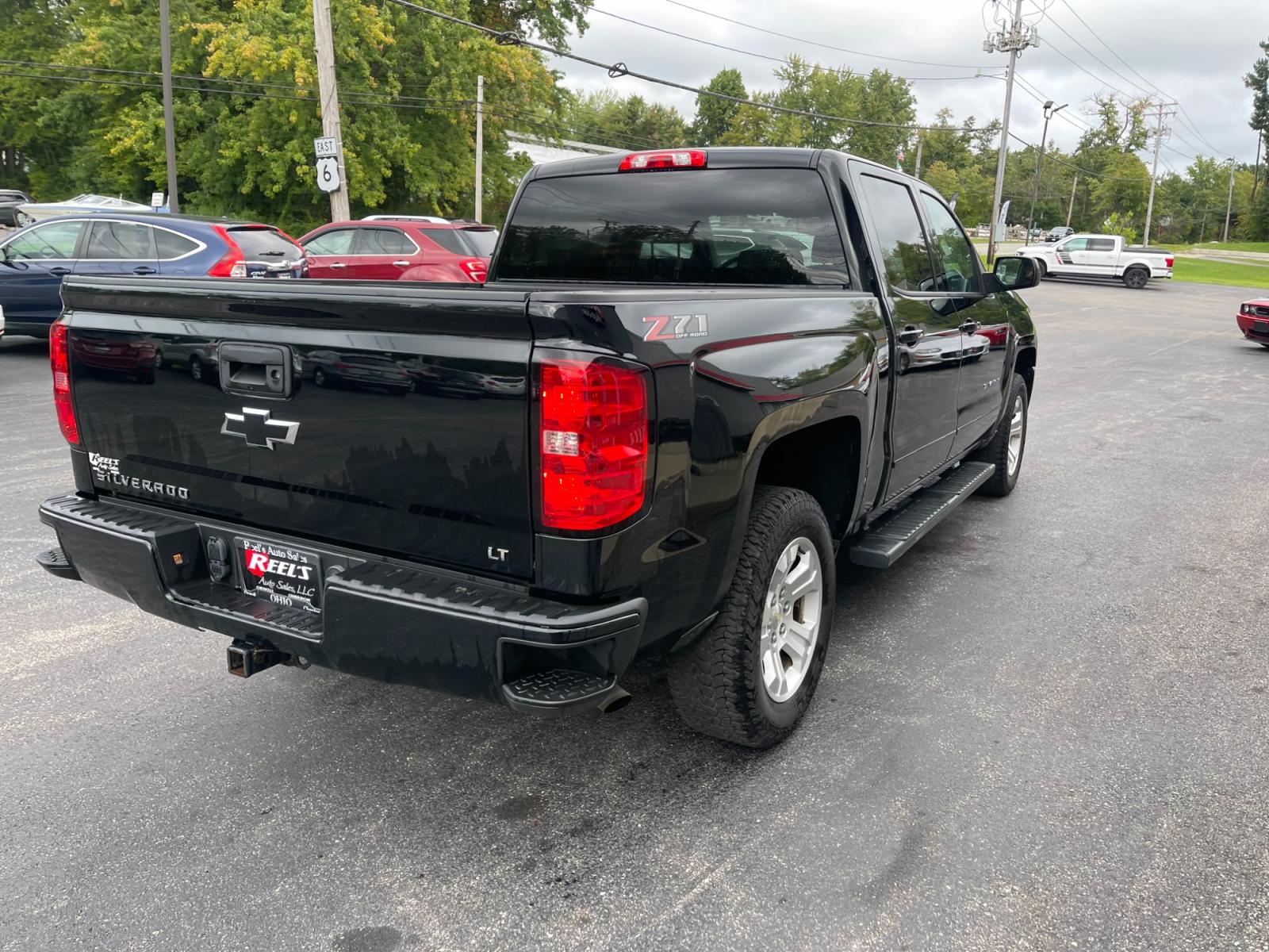 2018 Black /Black Chevrolet Silverado 1500 2LT Crew Cab 4WD (3GCUKREC9JG) with an 5.3L V8 OHV 16V engine, 6A transmission, located at 11115 Chardon Rd. , Chardon, OH, 44024, (440) 214-9705, 41.580246, -81.241943 - The 2018 Chevrolet Silverado 2LT Crew Cab Z71 5.3 comes with a powerful 5.3-liter V8 engine that generates 355 horsepower and 383 lb-ft of torque. It has a towing capacity of up to 9,100 pounds and can go from 0 to 60 mph in 6.7 seconds. The Z71 package includes off-road suspension, skid plates, and - Photo #8