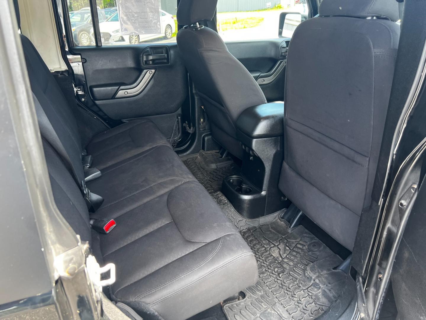 2015 Black /Black Jeep Wrangler Unlimited Willys 4WD (1C4BJWDG9FL) with an 3.6L V6 DOHC 24V engine, 6 Speed Manual transmission, located at 11115 Chardon Rd. , Chardon, OH, 44024, (440) 214-9705, 41.580246, -81.241943 - This 2015 Jeep Wrangler Unlimited Willy Wheeler Edition is a capable and well-equipped off-road vehicle. It features a 3.6-liter Pentastar V6 engine paired with a 6-speed manual transmission, offering a traditional driving experience favored by many off-road enthusiasts. The vehicle comes with sever - Photo#31