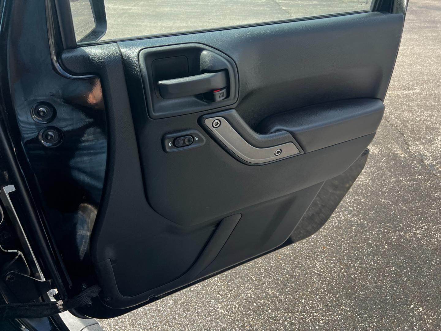 2015 Black /Black Jeep Wrangler Unlimited Willys 4WD (1C4BJWDG9FL) with an 3.6L V6 DOHC 24V engine, 6 Speed Manual transmission, located at 11115 Chardon Rd. , Chardon, OH, 44024, (440) 214-9705, 41.580246, -81.241943 - This 2015 Jeep Wrangler Unlimited Willy Wheeler Edition is a capable and well-equipped off-road vehicle. It features a 3.6-liter Pentastar V6 engine paired with a 6-speed manual transmission, offering a traditional driving experience favored by many off-road enthusiasts. The vehicle comes with sever - Photo#37