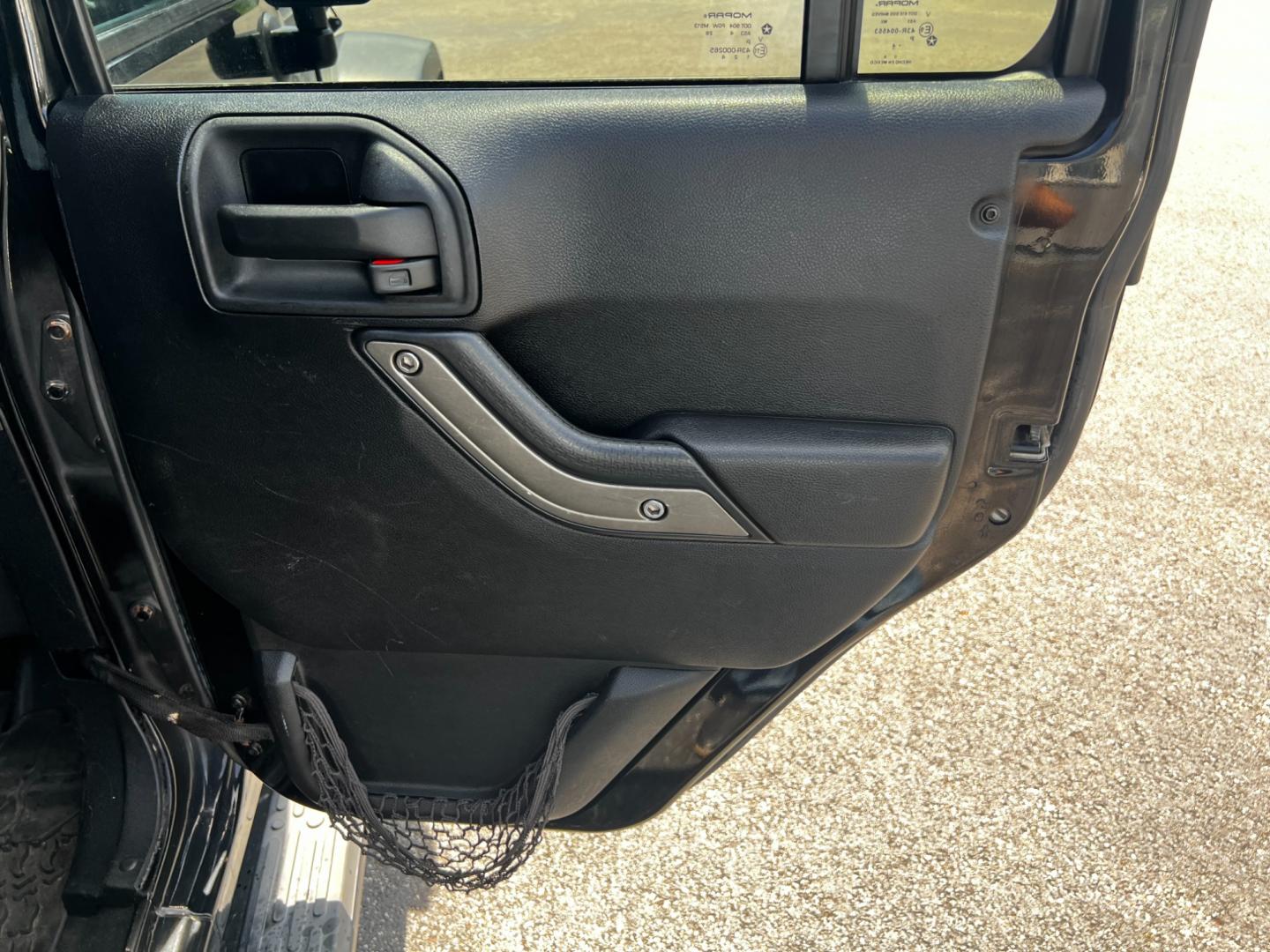 2015 Black /Black Jeep Wrangler Unlimited Willys 4WD (1C4BJWDG9FL) with an 3.6L V6 DOHC 24V engine, 6 Speed Manual transmission, located at 11115 Chardon Rd. , Chardon, OH, 44024, (440) 214-9705, 41.580246, -81.241943 - This 2015 Jeep Wrangler Unlimited Willy Wheeler Edition is a capable and well-equipped off-road vehicle. It features a 3.6-liter Pentastar V6 engine paired with a 6-speed manual transmission, offering a traditional driving experience favored by many off-road enthusiasts. The vehicle comes with sever - Photo#32
