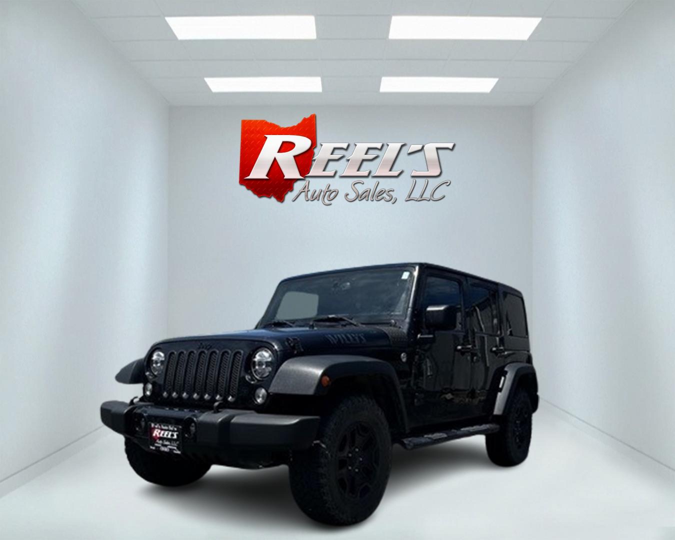 2015 Black /Black Jeep Wrangler Unlimited Willys 4WD (1C4BJWDG9FL) with an 3.6L V6 DOHC 24V engine, 6 Speed Manual transmission, located at 11115 Chardon Rd. , Chardon, OH, 44024, (440) 214-9705, 41.580246, -81.241943 - This 2015 Jeep Wrangler Unlimited Willy Wheeler Edition is a capable and well-equipped off-road vehicle. It features a 3.6-liter Pentastar V6 engine paired with a 6-speed manual transmission, offering a traditional driving experience favored by many off-road enthusiasts. The vehicle comes with sever - Photo#0