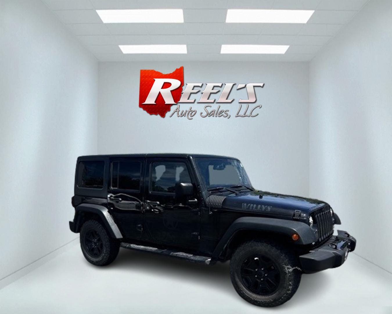 2015 Black /Black Jeep Wrangler Unlimited Willys 4WD (1C4BJWDG9FL) with an 3.6L V6 DOHC 24V engine, 6 Speed Manual transmission, located at 11115 Chardon Rd. , Chardon, OH, 44024, (440) 214-9705, 41.580246, -81.241943 - This 2015 Jeep Wrangler Unlimited Willy Wheeler Edition is a capable and well-equipped off-road vehicle. It features a 3.6-liter Pentastar V6 engine paired with a 6-speed manual transmission, offering a traditional driving experience favored by many off-road enthusiasts. The vehicle comes with sever - Photo#3