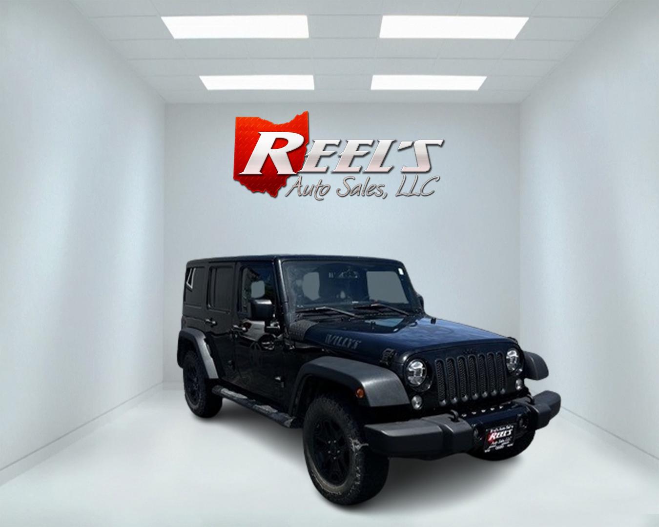 2015 Black /Black Jeep Wrangler Unlimited Willys 4WD (1C4BJWDG9FL) with an 3.6L V6 DOHC 24V engine, 6 Speed Manual transmission, located at 11115 Chardon Rd. , Chardon, OH, 44024, (440) 214-9705, 41.580246, -81.241943 - This 2015 Jeep Wrangler Unlimited Willy Wheeler Edition is a capable and well-equipped off-road vehicle. It features a 3.6-liter Pentastar V6 engine paired with a 6-speed manual transmission, offering a traditional driving experience favored by many off-road enthusiasts. The vehicle comes with sever - Photo#2