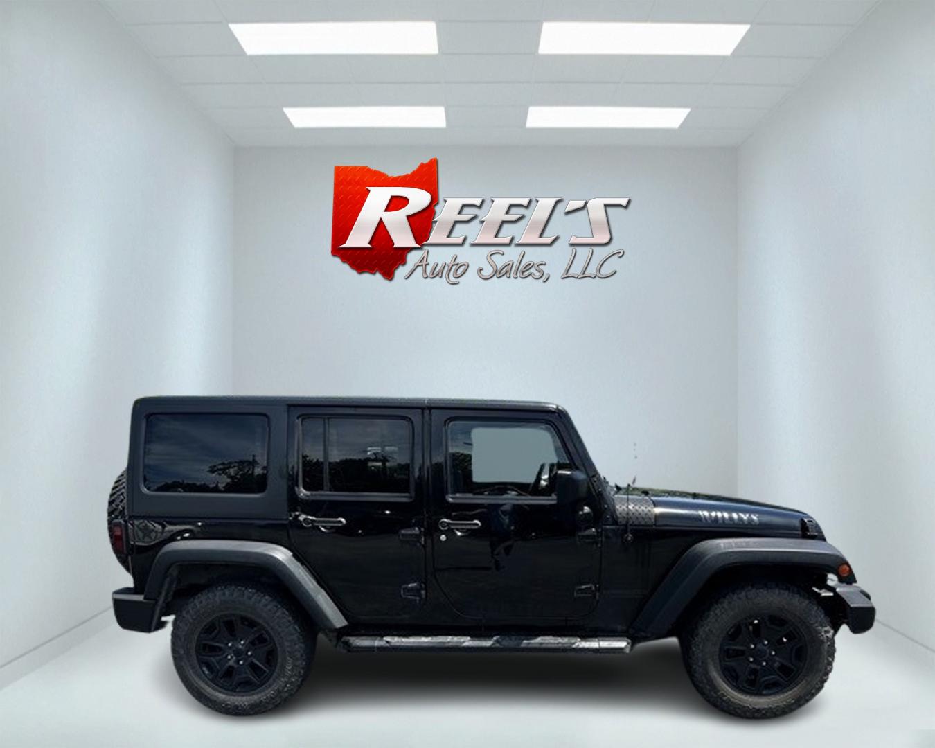 2015 Black /Black Jeep Wrangler Unlimited Willys 4WD (1C4BJWDG9FL) with an 3.6L V6 DOHC 24V engine, 6 Speed Manual transmission, located at 11115 Chardon Rd. , Chardon, OH, 44024, (440) 214-9705, 41.580246, -81.241943 - This 2015 Jeep Wrangler Unlimited Willy Wheeler Edition is a capable and well-equipped off-road vehicle. It features a 3.6-liter Pentastar V6 engine paired with a 6-speed manual transmission, offering a traditional driving experience favored by many off-road enthusiasts. The vehicle comes with sever - Photo#4