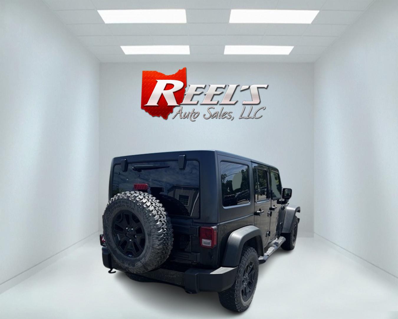 2015 Black /Black Jeep Wrangler Unlimited Willys 4WD (1C4BJWDG9FL) with an 3.6L V6 DOHC 24V engine, 6 Speed Manual transmission, located at 11115 Chardon Rd. , Chardon, OH, 44024, (440) 214-9705, 41.580246, -81.241943 - This 2015 Jeep Wrangler Unlimited Willy Wheeler Edition is a capable and well-equipped off-road vehicle. It features a 3.6-liter Pentastar V6 engine paired with a 6-speed manual transmission, offering a traditional driving experience favored by many off-road enthusiasts. The vehicle comes with sever - Photo#5