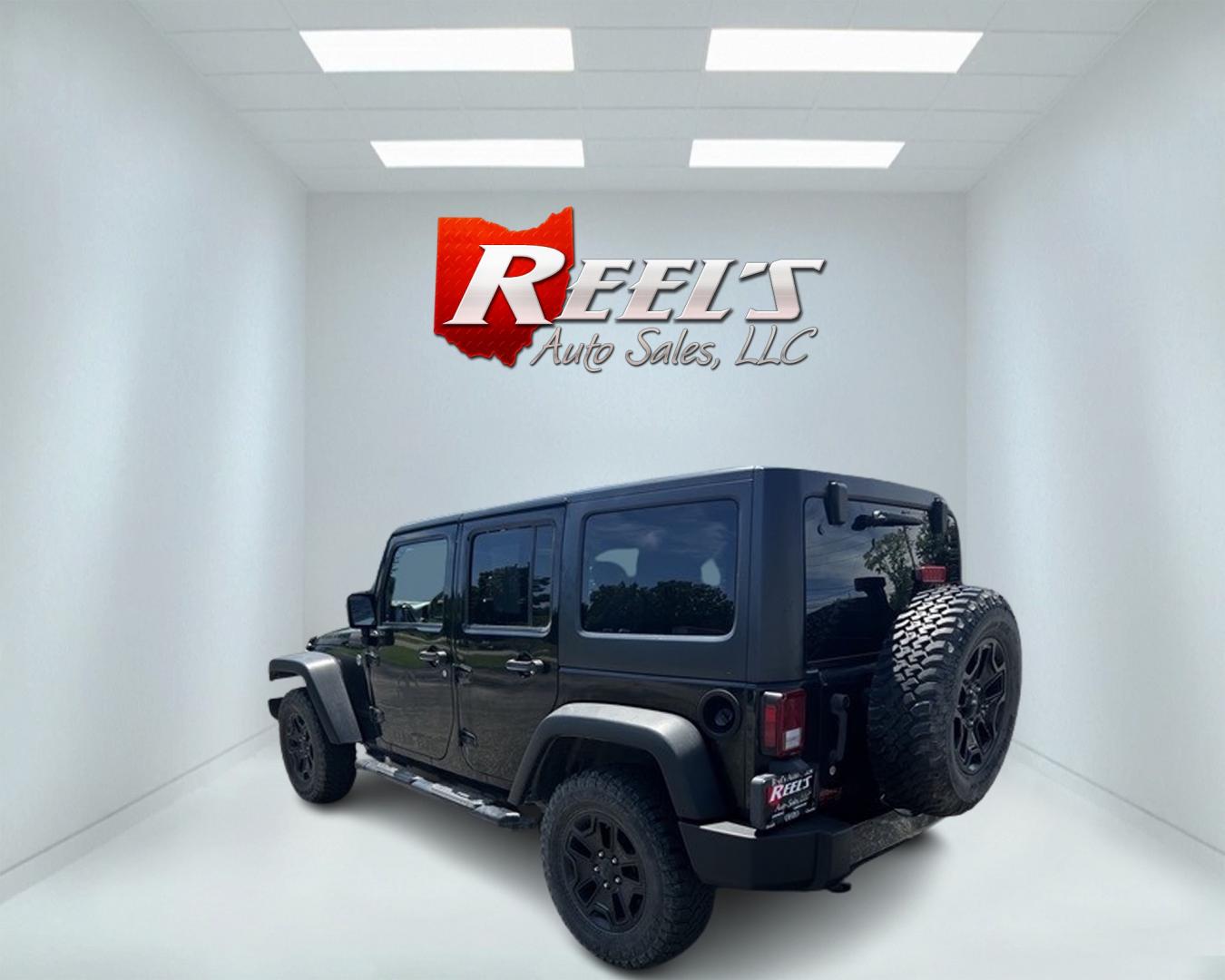 2015 Black /Black Jeep Wrangler Unlimited Willys 4WD (1C4BJWDG9FL) with an 3.6L V6 DOHC 24V engine, 6 Speed Manual transmission, located at 11115 Chardon Rd. , Chardon, OH, 44024, (440) 214-9705, 41.580246, -81.241943 - This 2015 Jeep Wrangler Unlimited Willy Wheeler Edition is a capable and well-equipped off-road vehicle. It features a 3.6-liter Pentastar V6 engine paired with a 6-speed manual transmission, offering a traditional driving experience favored by many off-road enthusiasts. The vehicle comes with sever - Photo#7