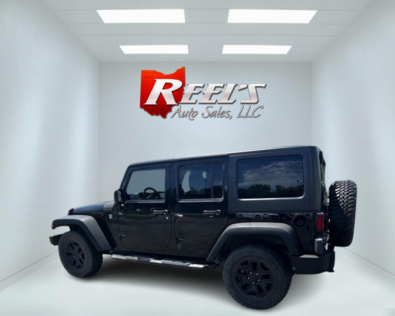 2015 Black /Black Jeep Wrangler Unlimited Willys 4WD (1C4BJWDG9FL) with an 3.6L V6 DOHC 24V engine, 6 Speed Manual transmission, located at 11115 Chardon Rd. , Chardon, OH, 44024, (440) 214-9705, 41.580246, -81.241943 - This 2015 Jeep Wrangler Unlimited Willy Wheeler Edition is a capable and well-equipped off-road vehicle. It features a 3.6-liter Pentastar V6 engine paired with a 6-speed manual transmission, offering a traditional driving experience favored by many off-road enthusiasts. The vehicle comes with sever - Photo#8