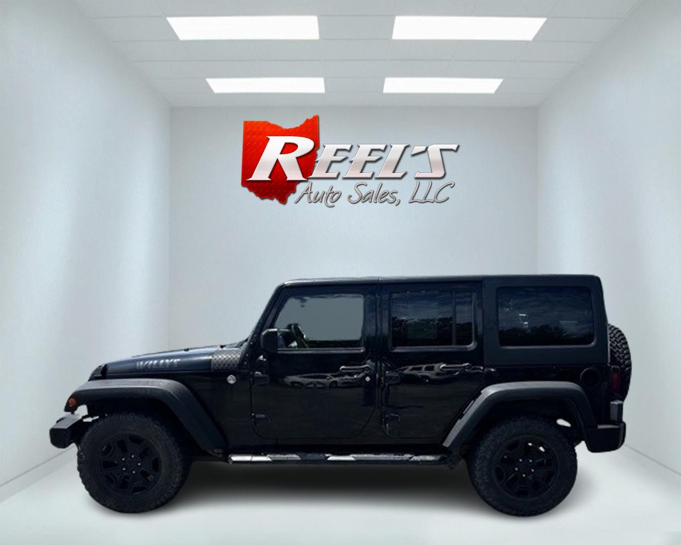 2015 Black /Black Jeep Wrangler Unlimited Willys 4WD (1C4BJWDG9FL) with an 3.6L V6 DOHC 24V engine, 6 Speed Manual transmission, located at 11115 Chardon Rd. , Chardon, OH, 44024, (440) 214-9705, 41.580246, -81.241943 - This 2015 Jeep Wrangler Unlimited Willy Wheeler Edition is a capable and well-equipped off-road vehicle. It features a 3.6-liter Pentastar V6 engine paired with a 6-speed manual transmission, offering a traditional driving experience favored by many off-road enthusiasts. The vehicle comes with sever - Photo#9