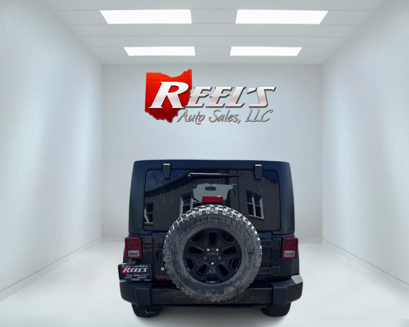 2015 Black /Black Jeep Wrangler Unlimited Willys 4WD (1C4BJWDG9FL) with an 3.6L V6 DOHC 24V engine, 6 Speed Manual transmission, located at 11115 Chardon Rd. , Chardon, OH, 44024, (440) 214-9705, 41.580246, -81.241943 - This 2015 Jeep Wrangler Unlimited Willy Wheeler Edition is a capable and well-equipped off-road vehicle. It features a 3.6-liter Pentastar V6 engine paired with a 6-speed manual transmission, offering a traditional driving experience favored by many off-road enthusiasts. The vehicle comes with sever - Photo#6