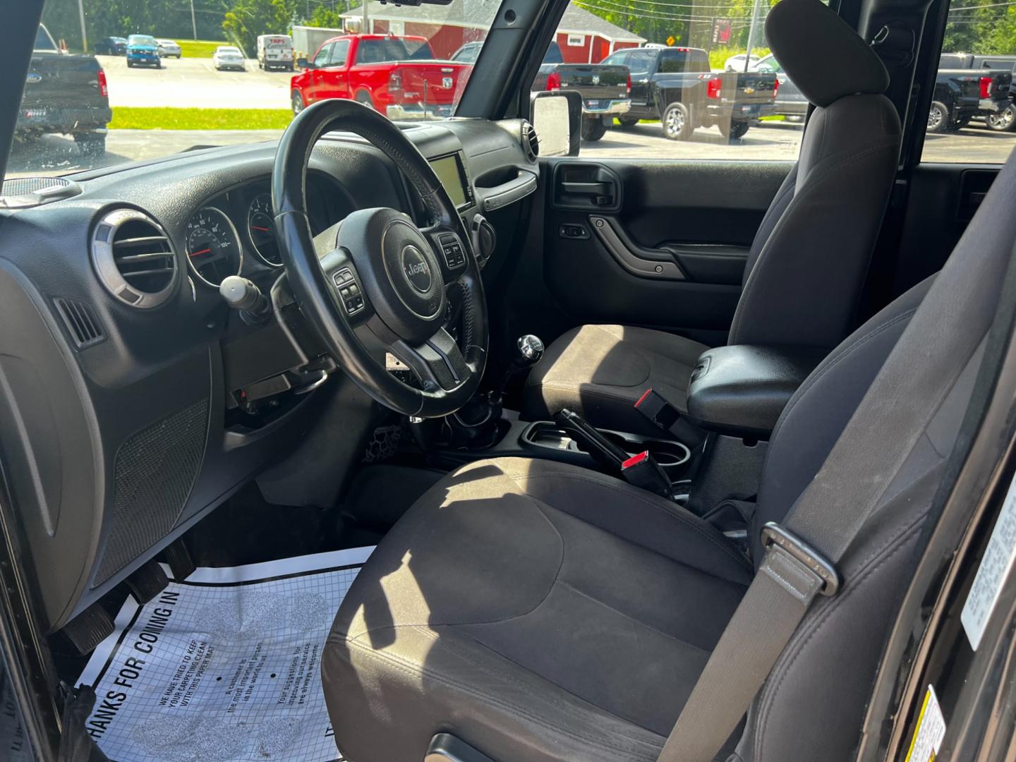 2015 Black /Black Jeep Wrangler Unlimited Willys 4WD (1C4BJWDG9FL) with an 3.6L V6 DOHC 24V engine, 6 Speed Manual transmission, located at 11115 Chardon Rd. , Chardon, OH, 44024, (440) 214-9705, 41.580246, -81.241943 - This 2015 Jeep Wrangler Unlimited Willy Wheeler Edition is a capable and well-equipped off-road vehicle. It features a 3.6-liter Pentastar V6 engine paired with a 6-speed manual transmission, offering a traditional driving experience favored by many off-road enthusiasts. The vehicle comes with sever - Photo#15