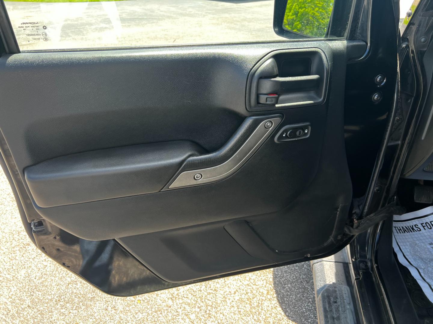 2015 Black /Black Jeep Wrangler Unlimited Willys 4WD (1C4BJWDG9FL) with an 3.6L V6 DOHC 24V engine, 6 Speed Manual transmission, located at 11115 Chardon Rd. , Chardon, OH, 44024, (440) 214-9705, 41.580246, -81.241943 - This 2015 Jeep Wrangler Unlimited Willy Wheeler Edition is a capable and well-equipped off-road vehicle. It features a 3.6-liter Pentastar V6 engine paired with a 6-speed manual transmission, offering a traditional driving experience favored by many off-road enthusiasts. The vehicle comes with sever - Photo#16