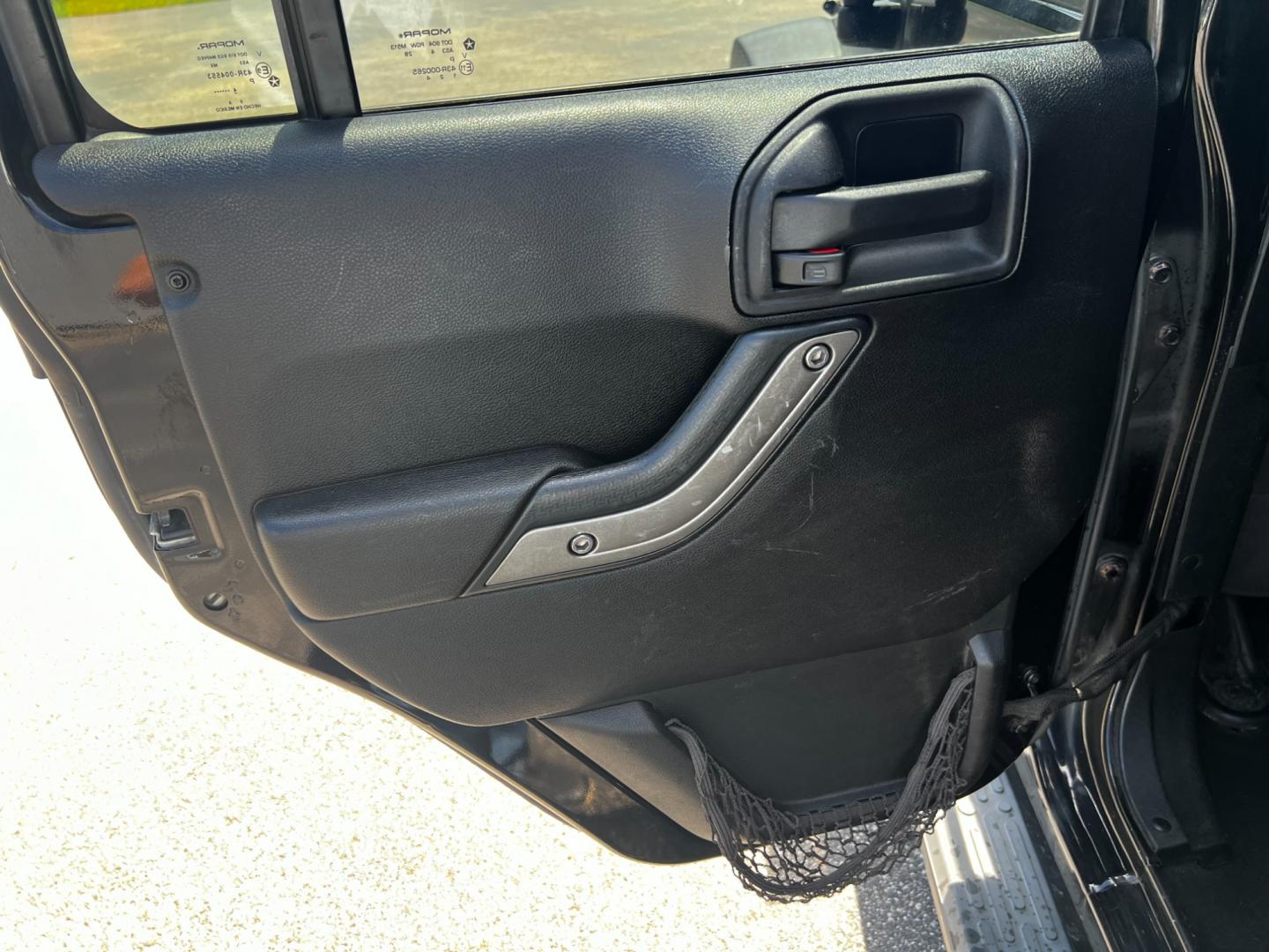 2015 Black /Black Jeep Wrangler Unlimited Willys 4WD (1C4BJWDG9FL) with an 3.6L V6 DOHC 24V engine, 6 Speed Manual transmission, located at 11115 Chardon Rd. , Chardon, OH, 44024, (440) 214-9705, 41.580246, -81.241943 - This 2015 Jeep Wrangler Unlimited Willy Wheeler Edition is a capable and well-equipped off-road vehicle. It features a 3.6-liter Pentastar V6 engine paired with a 6-speed manual transmission, offering a traditional driving experience favored by many off-road enthusiasts. The vehicle comes with sever - Photo#27