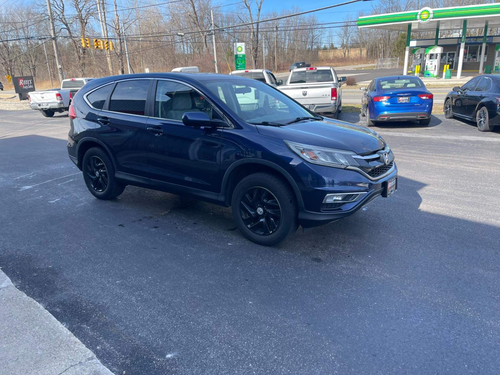 2015 Blue /Black Honda CR-V EX 4WD (2HKRM4H57FH) with an 2.4L I4 DOHC 16V engine, Automatic transmission, located at 547 E. Main St., Orwell, OH, 44076, (440) 437-5893, 41.535435, -80.847855 - 2015 Honda CR-V ---- All Wheel Drive ---- 28 MPG Combined ---- Heated Seats ---- Moon Roof ---- Fully Serviced and Recently Detailed ---- Reel's Auto Sales is located in both Chardon and Orwell Ohio. Financing available and trades welcome. Please call or text to confirm location, set an appointment - Photo #3