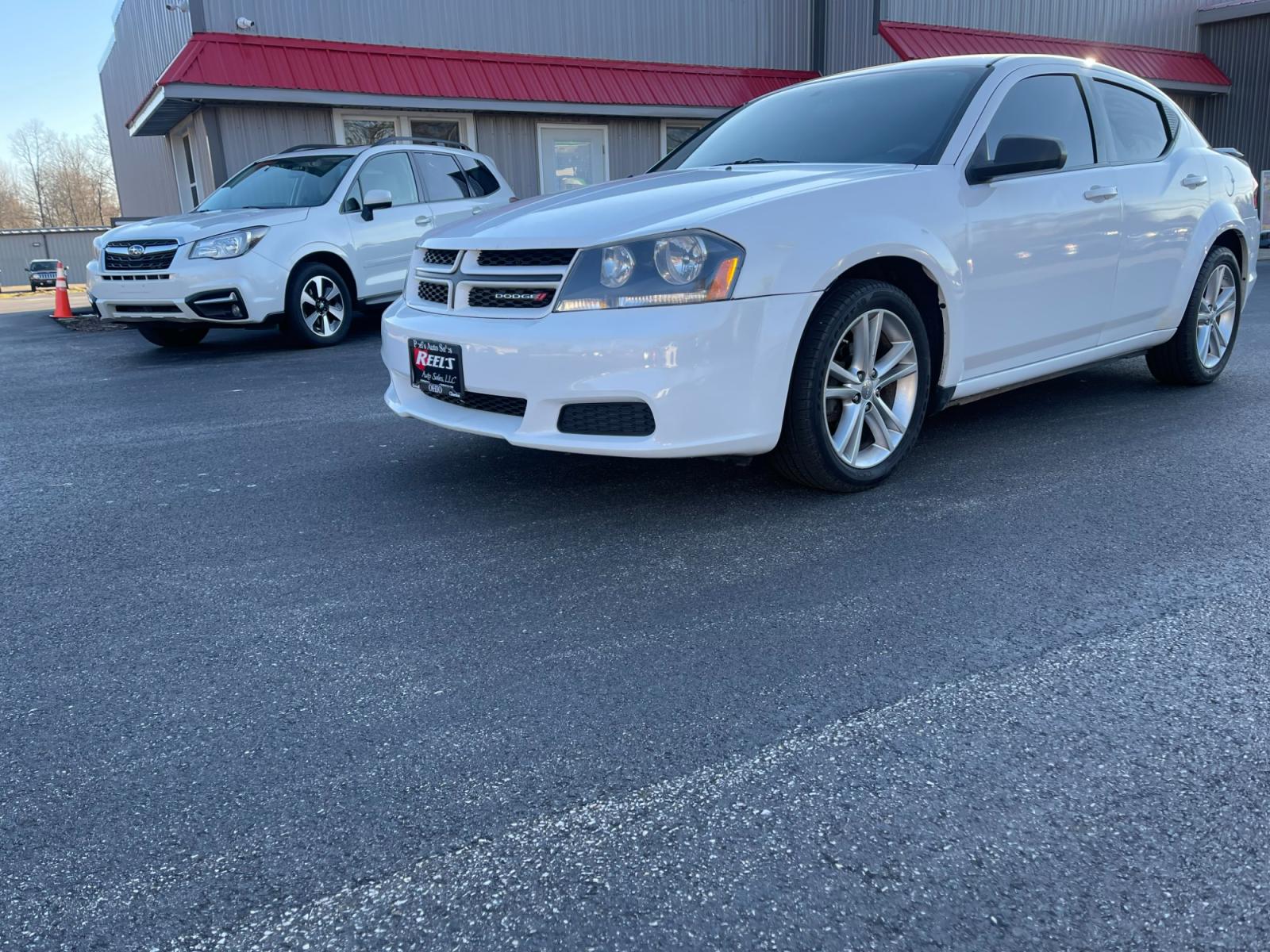2014 White /Black Dodge Avenger Rallye (1C3CDZAB0EN) with an 2.4L I4 DOHC 16V engine, 4-Speed Automatic transmission, located at 547 E. Main St., Orwell, OH, 44076, (440) 437-5893, 41.535435, -80.847855 - Photo #0