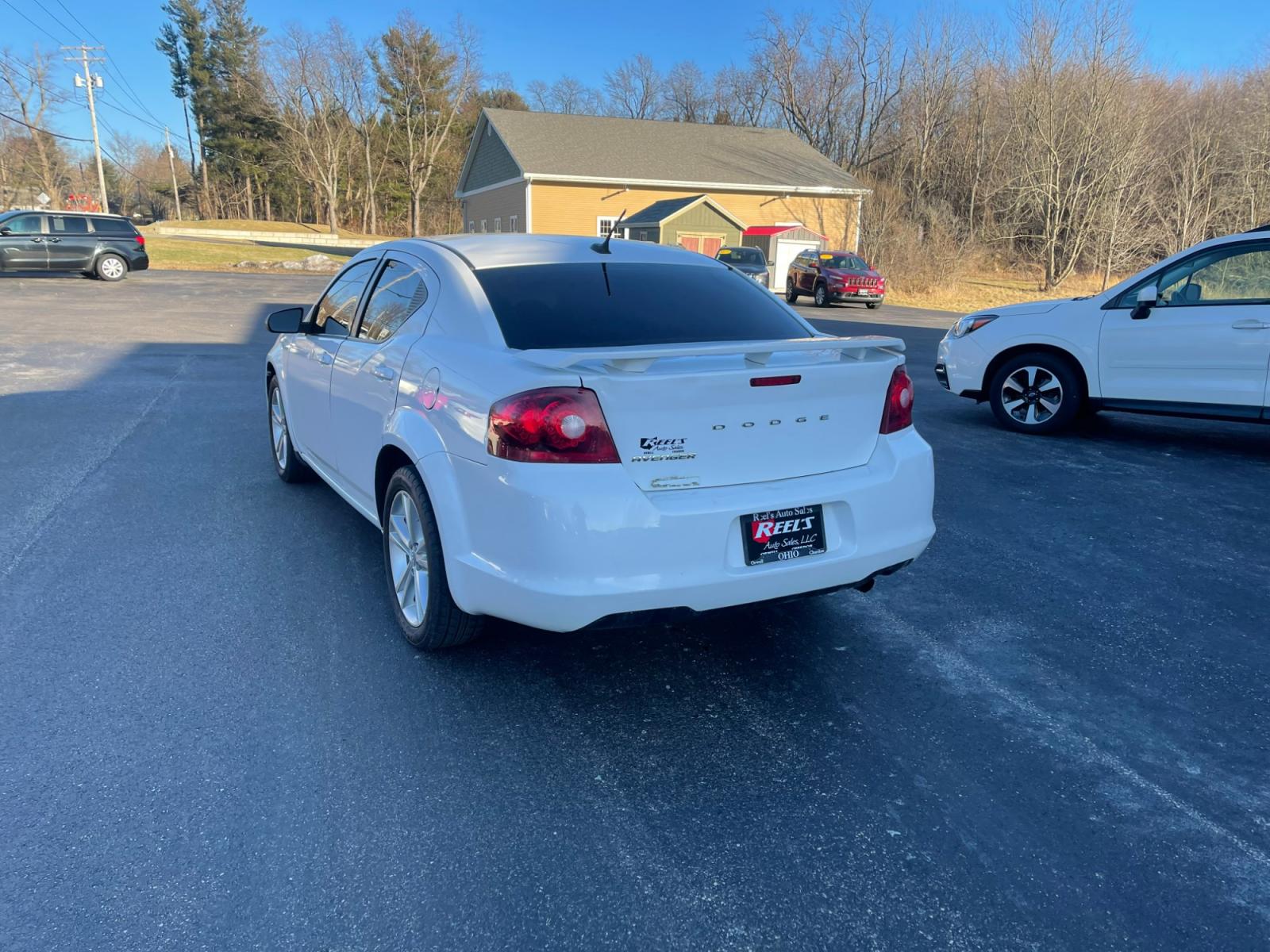 2014 White /Black Dodge Avenger Rallye (1C3CDZAB0EN) with an 2.4L I4 DOHC 16V engine, 4-Speed Automatic transmission, located at 547 E. Main St., Orwell, OH, 44076, (440) 437-5893, 41.535435, -80.847855 - Photo #9