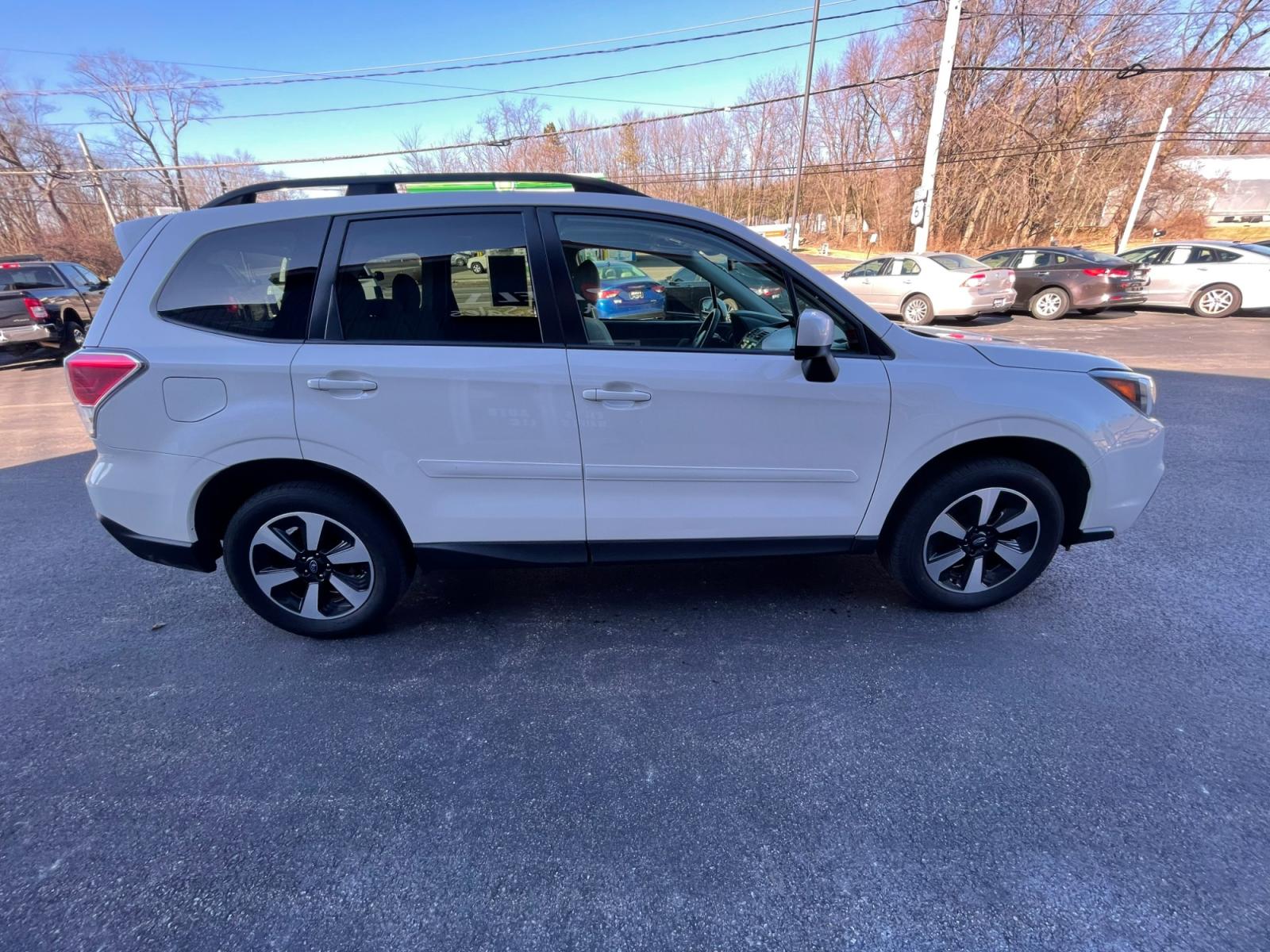 2018 White /Gray Subaru Forester 2.5i Premium PZEV CVT (JF2SJAGC0JH) with an 2.5L H4 SOHC 16V engine, Automatic transmission, located at 11115 Chardon Rd. , Chardon, OH, 44024, (440) 214-9705, 41.580246, -81.241943 - 2018 Subaru Forester ---- One Owner Carfax ---- 86K Miles ---- All Wheel Drive ----- 28 MPG Combined ---- Panoramic Moon Roof ---- Fully Serviced and Recently Detailed ---- Reel's Auto Sales is located in both Chardon and Orwell Ohio. Financing available and trades welcome. Please call or text to co - Photo #5