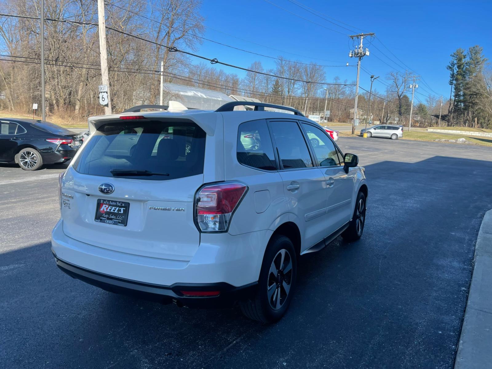 2018 White /Gray Subaru Forester 2.5i Premium PZEV CVT (JF2SJAGC0JH) with an 2.5L H4 SOHC 16V engine, Automatic transmission, located at 11115 Chardon Rd. , Chardon, OH, 44024, (440) 214-9705, 41.580246, -81.241943 - 2018 Subaru Forester ---- One Owner Carfax ---- 86K Miles ---- All Wheel Drive ----- 28 MPG Combined ---- Panoramic Moon Roof ---- Fully Serviced and Recently Detailed ---- Reel's Auto Sales is located in both Chardon and Orwell Ohio. Financing available and trades welcome. Please call or text to co - Photo #7