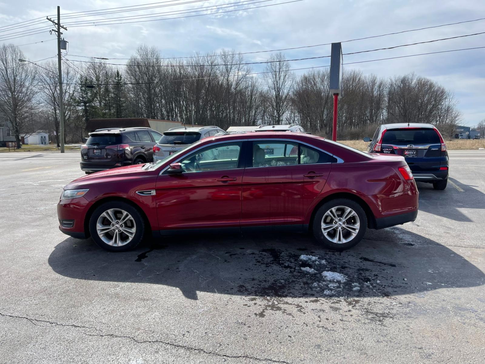 2013 Red /Tan Ford Taurus SEL FWD (1FAHP2E86DG) with an 3.5L V6 DOHC 24V engine, 6-Speed Automatic transmission, located at 547 E. Main St., Orwell, OH, 44076, (440) 437-5893, 41.535435, -80.847855 - Photo #14