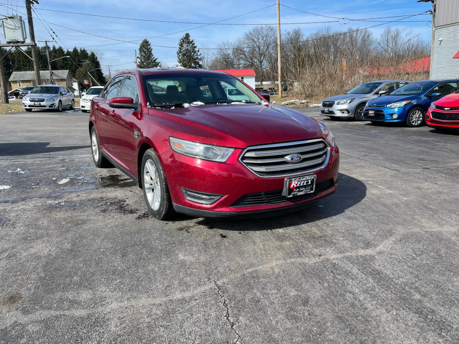 2013 Red /Tan Ford Taurus SEL FWD (1FAHP2E86DG) with an 3.5L V6 DOHC 24V engine, 6-Speed Automatic transmission, located at 547 E. Main St., Orwell, OH, 44076, (440) 437-5893, 41.535435, -80.847855 - Photo #2