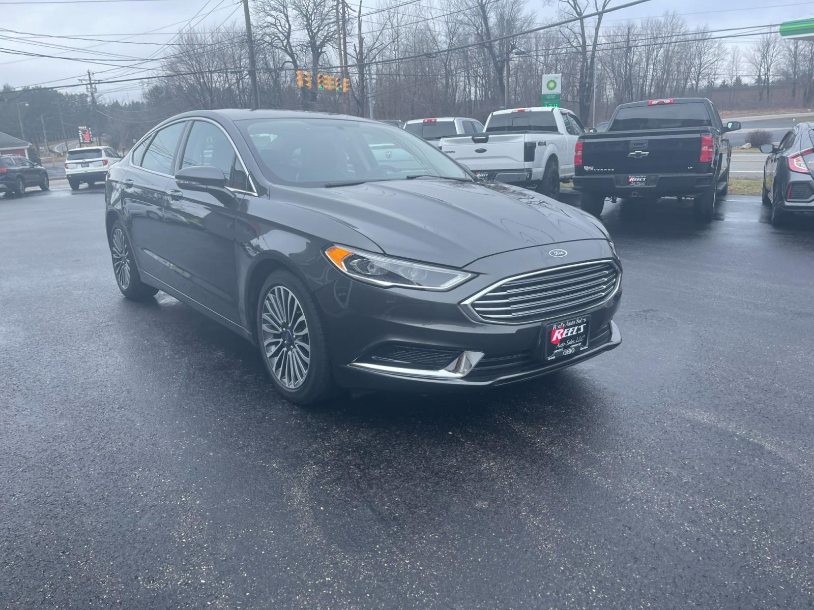 2018 Gray /Black Ford Fusion SE (3FA6P0HD6JR) with an 1.5L I4 DOHC 16V TURBO engine, 6A transmission, located at 11115 Chardon Rd. , Chardon, OH, 44024, (440) 214-9705, 41.580246, -81.241943 - 2018 Ford Fusion SE ---- One Owner Carfax ---- Only 19K Miles ---- Heated Leather Interior ---- 27 MPG Combined ---- Fully Serviced and Recently Detailed ---- Reel's Auto Sales is located in both Chardon and Orwell Ohio. Financing available and trades welcome. Please call or text to confirm location - Photo #3