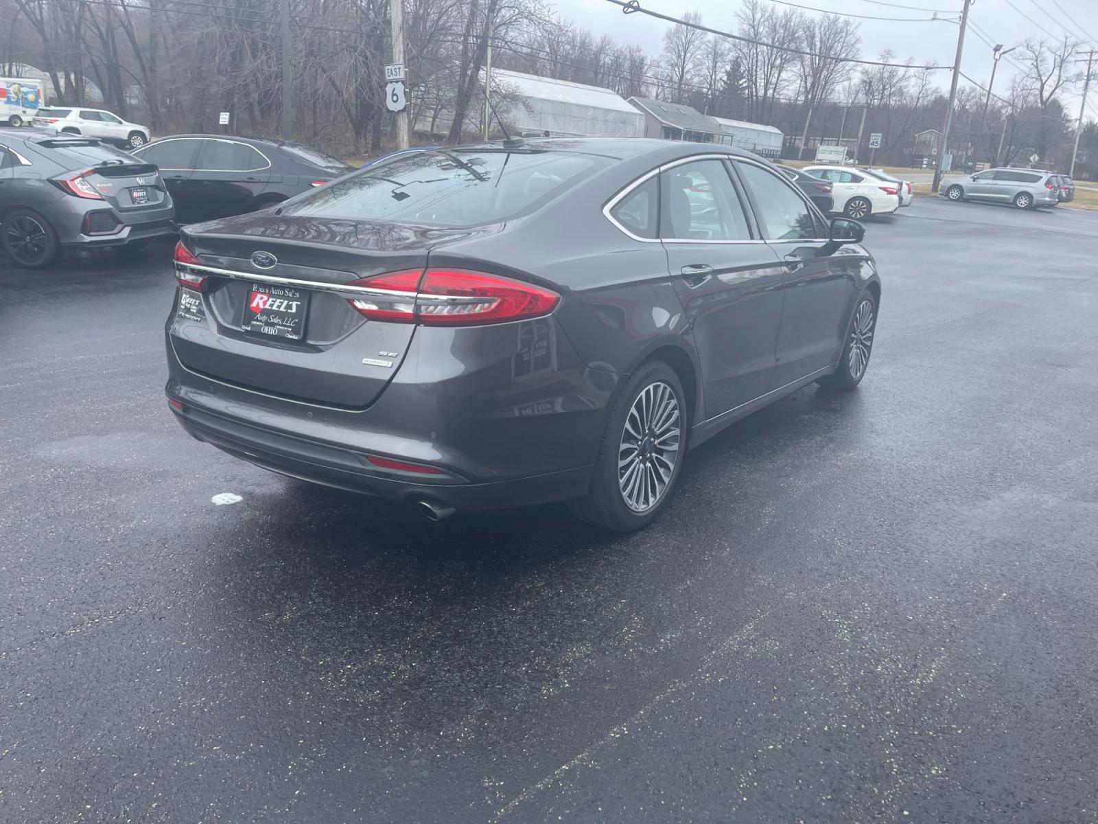 2018 Gray /Black Ford Fusion SE (3FA6P0HD6JR) with an 1.5L I4 DOHC 16V TURBO engine, 6A transmission, located at 11115 Chardon Rd. , Chardon, OH, 44024, (440) 214-9705, 41.580246, -81.241943 - 2018 Ford Fusion SE ---- One Owner Carfax ---- Only 19K Miles ---- Heated Leather Interior ---- 27 MPG Combined ---- Fully Serviced and Recently Detailed ---- Reel's Auto Sales is located in both Chardon and Orwell Ohio. Financing available and trades welcome. Please call or text to confirm location - Photo #8