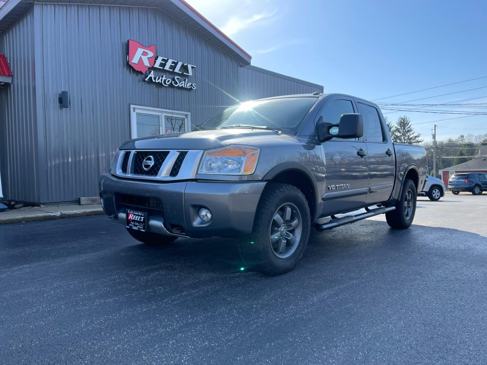 2013 Gray /Black Nissan Titan PRO-4X Crew Cab 4WD SWB (1N6AA0EC1DN) with an 5.6L V8 DOHC 32V engine, 5-Speed Automatic transmission, located at 547 E. Main St., Orwell, OH, 44076, (440) 437-5893, 41.535435, -80.847855 - 2013 Nissan Titan PRO-4X ---- Heated Leather Seats ---- Big Tow Package ---- 5.6L V8 ---- Fully Serviced and Recently Detailed ---- Reel's Auto Sales is located in both Chardon and Orwell Ohio. Financing available and trades welcome. Please call or text to confirm location, set an appointment or dis - Photo #0