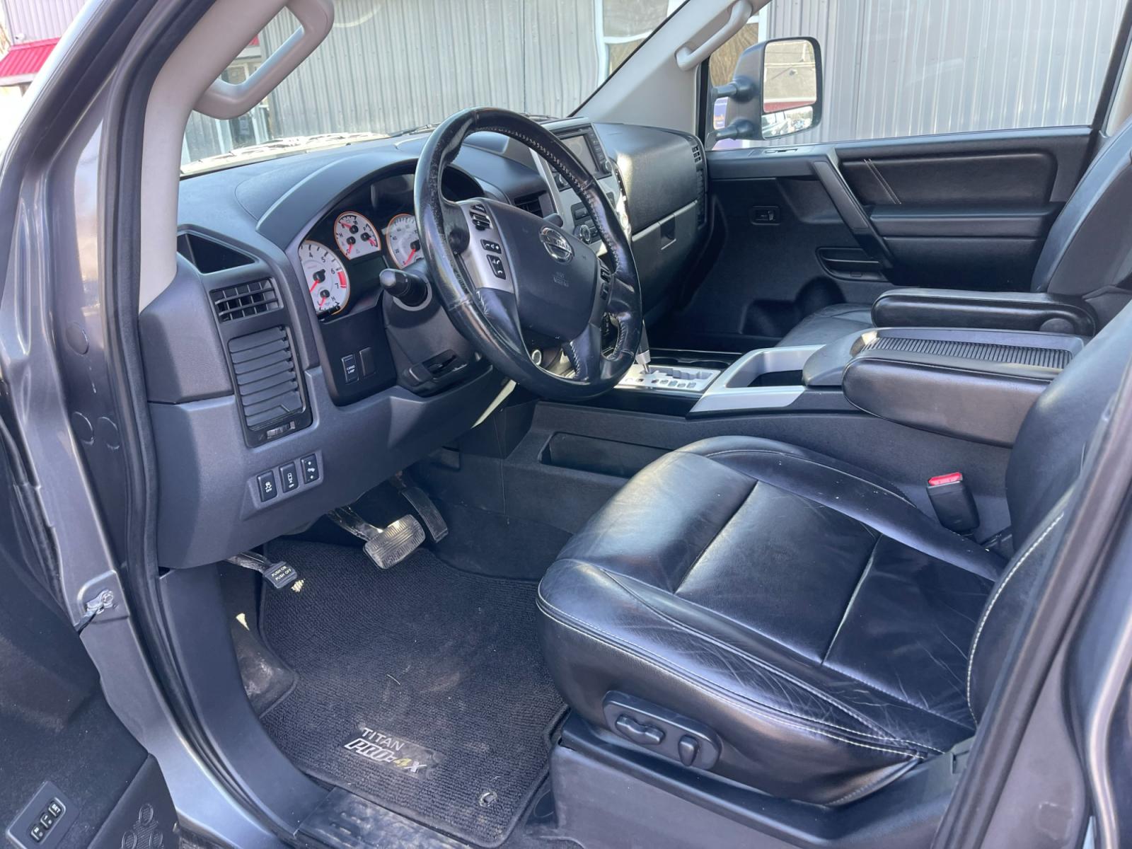 2013 Gray /Black Nissan Titan PRO-4X Crew Cab 4WD SWB (1N6AA0EC1DN) with an 5.6L V8 DOHC 32V engine, 5-Speed Automatic transmission, located at 547 E. Main St., Orwell, OH, 44076, (440) 437-5893, 41.535435, -80.847855 - 2013 Nissan Titan PRO-4X ---- Heated Leather Seats ---- Big Tow Package ---- 5.6L V8 ---- Fully Serviced and Recently Detailed ---- Reel's Auto Sales is located in both Chardon and Orwell Ohio. Financing available and trades welcome. Please call or text to confirm location, set an appointment or dis - Photo #16