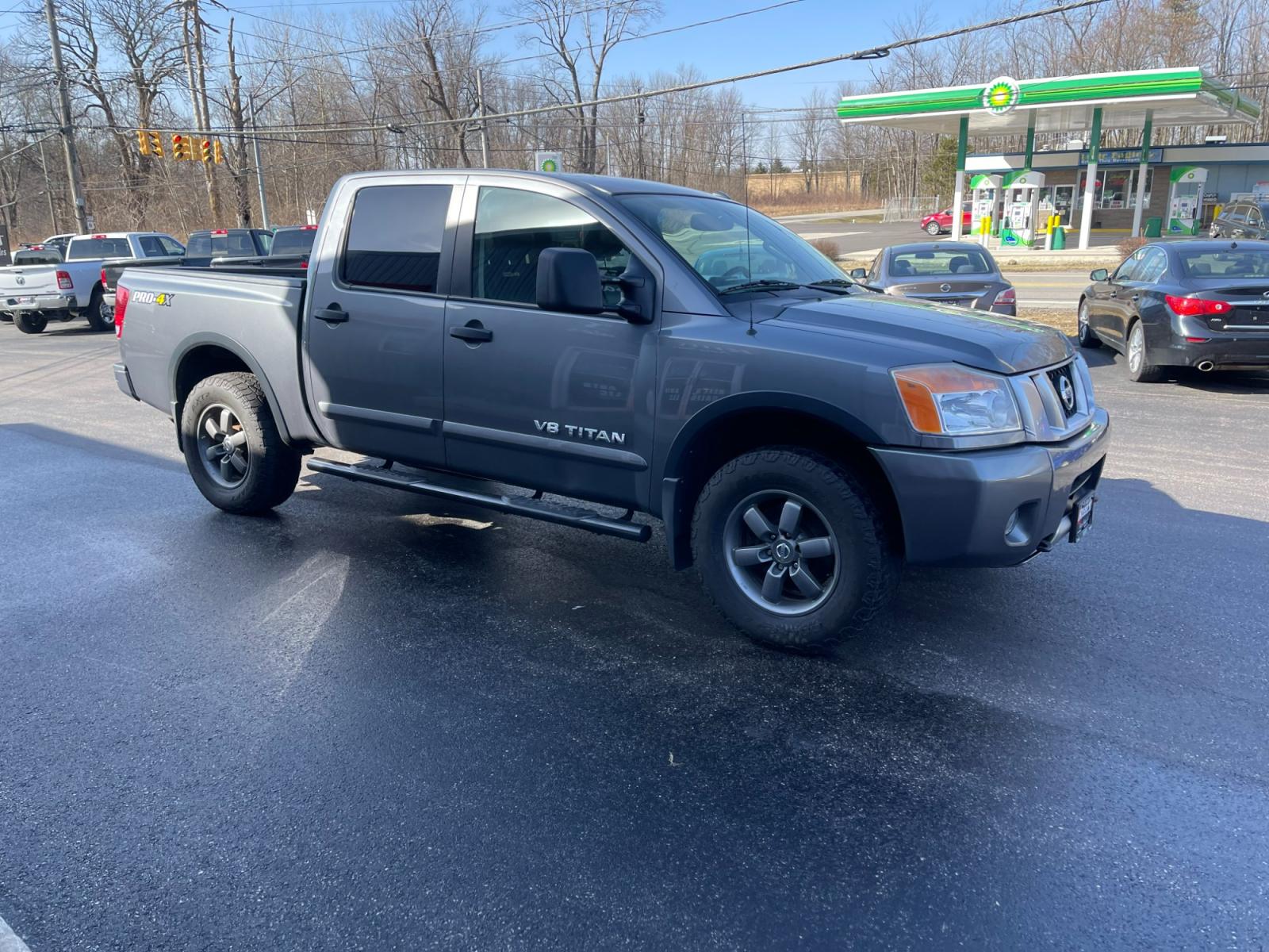 2013 Gray /Black Nissan Titan PRO-4X Crew Cab 4WD SWB (1N6AA0EC1DN) with an 5.6L V8 DOHC 32V engine, 5-Speed Automatic transmission, located at 547 E. Main St., Orwell, OH, 44076, (440) 437-5893, 41.535435, -80.847855 - 2013 Nissan Titan PRO-4X ---- Heated Leather Seats ---- Big Tow Package ---- 5.6L V8 ---- Fully Serviced and Recently Detailed ---- Reel's Auto Sales is located in both Chardon and Orwell Ohio. Financing available and trades welcome. Please call or text to confirm location, set an appointment or dis - Photo #3